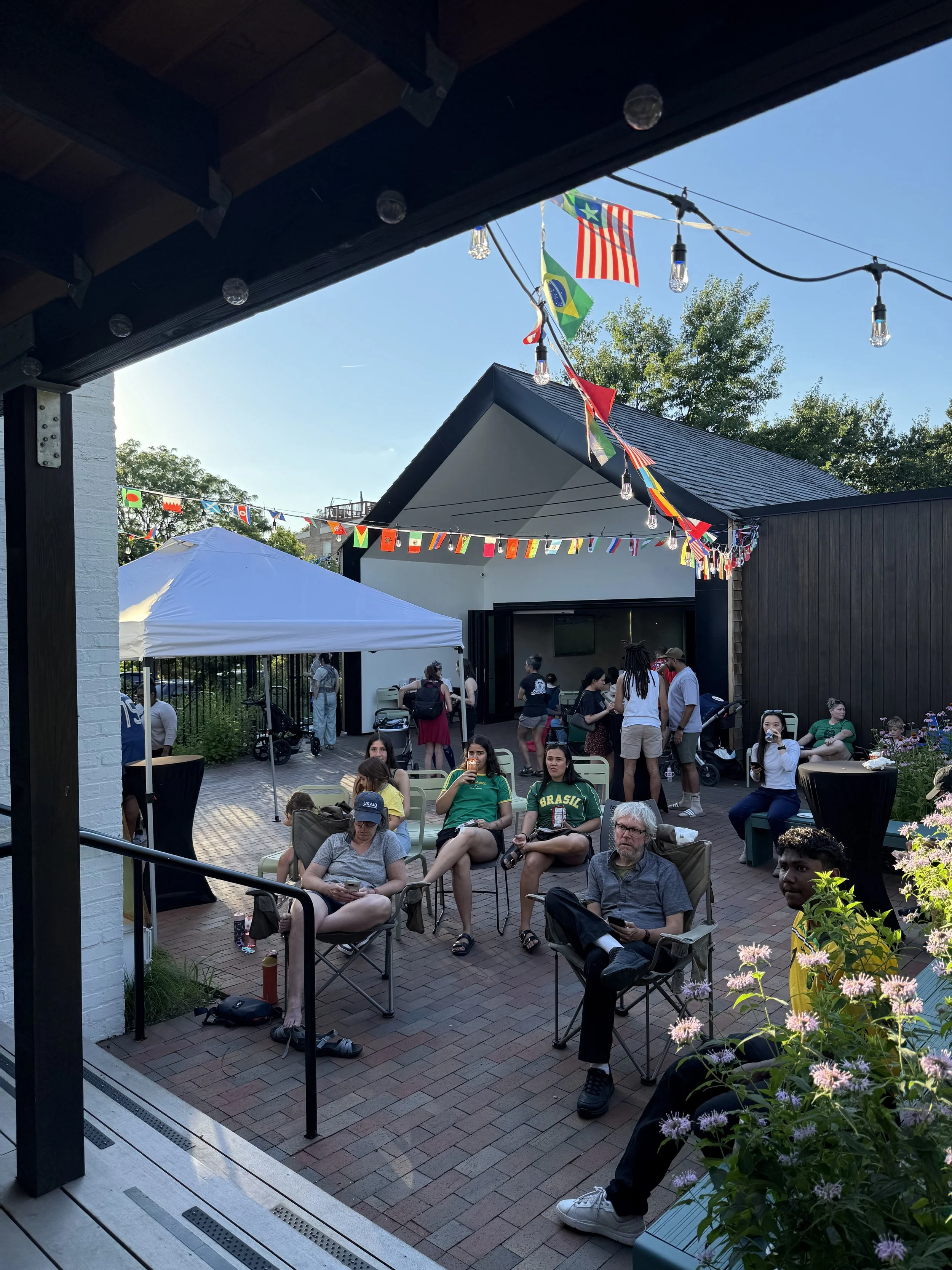  Over 70 neighbors stopped over at the Cedar House to watch simultaneous World Cup games 