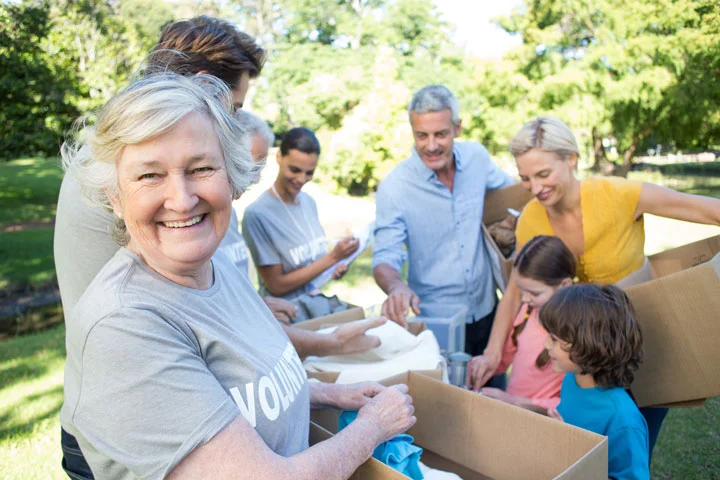 The holidays are often called the season of giving. For children, this often comes in the form of receiving presents and gifts from friends and family. However, there are a number of ways that parents can teach their kids to give back to the community, especially during this festive time of year. The following are four easy ways to teach kids how to give back to others. 1. Volunteer as a family. Often the best way to help children get involved is by volunteering together. Find a charity or group that the whole family can help, such as a local animal shelter or community garden. Volunteering together helps give back to the community while also letting your family create quality memories while spending time together. 2. Involve them in the process. If you are cleaning out the house looking for items to donate, avoid discriminately picking clothes or toys without consulting your child. Instead, ask them to help you pick out items to give to other boys and girls; you may be surprised at how thoughtful and insightful even young children can be when it comes to making decisions together! 3. One in, one out . It can be easy to feel as if you are drowning under a mountain of your child’s clothes, toys, or games. To prevent an overload of stuff – especially after the holidays have come and gone – put a one in, one out rule into effect. For every one new item your child buys or receives, they have to donate one old item to charity. Not only does this reduce the clutter in your home, but it also helps your child give back to others. 4. Model your own behavior. Children learn by example, and our actions are more telling than our words. Show your child how important giving back to the community is by doing your own volunteering. Whether you’re collecting donations, volunteering in person, or even donating to a favorite charity, modeling giving back to the community can have a big impact on a child. Spread joy and cheer this holiday season by helping your child volunteer and give back to their local community! Volunteering and giving back to the community can help children learn how to positively impact the lives of those around them.