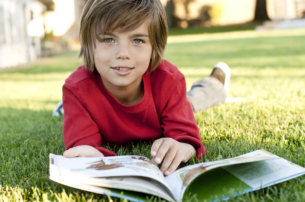 Book clubs aren’t just for adults! Whether your child is a bookworm or a reluctant reader, a book club is a fun, social way to explore reading outside of school. A kid’s book club can help your child develop friendships outside of school, explore their interests, and create a lifelong love of learning. The following tips can help you and your child start a book club in your area. 1. Schedule the first meeting. Find a meeting location that is convenient to all the children invited. Parks and libraries are good locations, while members can also take turns hosting in their homes. Most book clubs meet once per month, which gives time between meetings for everyone to read the chosen book. 2. Send out the invitations. Help your child design and send invitations to the book club meeting. Ideally, book clubs should have between five and eight members. The amount of members encourages lively conversation while still giving everyone a chance to speak. While children of all ages can participate, independent readers in second grade and up are often most interested in reading and book discussion. 3. Provide drinks and snacks. Starting book club with a healthy snack is a great way to break the ice at the beginning of each meeting. Get creative by thinking of snacks that tie in to that month’s book! 4. Jumpstart the discussion. Parents can help start the discussion by asking guiding questions. Who was your favorite character? Did you like how the book ended? What was your favorite scene? 5. Plan a second activity. After the discussion, plan an activity or game that goes along with the theme of the book. After reading Diary Of A Wimpy Kid by Jeff Kinney children can make their own comic strips. If Gloria Whelan’s Homeless Bird was the book of the month, help kids make their own pinecone bird feeders. 6. Tie in a movie. Movies can still be a part of book club! If the book of the month has an age-appropriate adaptation, consider watching the movie after reading and discussing the novel. After the movie, compare and contrast the similarities and differences between the stories.