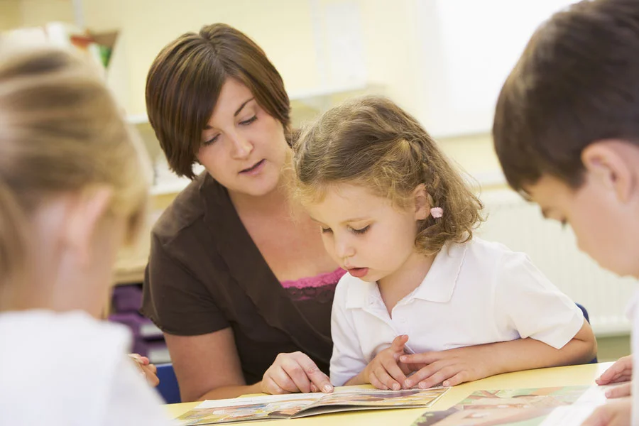 There are two skills that students need in order to become successful readers: recognition and comprehension. While recognition is about speed, recognizing sight vocabulary, and using phonics to sound out unfamiliar words, comprehension refers to how well children understand and remember what they’ve read. Because reading is an integral part of all other school subjects, it’s important for children to have a strong base in reading comprehension. Even if your child struggles with this critical reading skill, there are a number of ways to work on it both in school and at home. The following steps can help parents and teacher improve a child’s reading comprehension. 1. Choose the right books. Books that are too hard – or too easy – can affect reading comprehension. If a book is too hard, the child spends most of their mental energy on decoding the text; if a book is too easy, they’re apt to speed read or merely skim over paragraphs. Encourage students to follow the five-finger rule when choosing a book. Choose a book, open to a random page, and begin reading. Each time they come across an unfamiliar word, have them hold up a finger. No fingers or one finger is too easy, 2-3 fingers is just right, and 5 or more is too difficult. 2. Read aloud. While older children may scoff at the idea of reading aloud, it’s one of the most effective tools for reading comprehension. Students are forced to slow down as they read, giving them more processing time. Likewise, reading aloud gives them the chance to both see and hear the words, ideal for audio learners. 3. Reread to build fluency. To improve comprehension and gain deeper understanding of a text, rereading can be a valuable tool. While it may not be possible to reread entire novels, encourage students to reread short passages or paragraphs, particularly if they do not feel like they grasped the content the first time. Rereading can also be an extremely helpful test-taking strategy. 4. Ask questions . Even if you aren’t familiar with what they are reading, ask questions about the text. Not only does this force children to reflect on what they have read, but it also encourages them to ask themselves questions as they read. For example: - Before reading. What do you think this book will be about? Why did you choose it? - During reading. What is your favorite thing about the main character? Is it turning out how you thought it would? What do you think will happen next? - After reading. Can you summarize the book in three sentences? What did you most enjoy about the story? Does it remind you of anything else you’ve read?