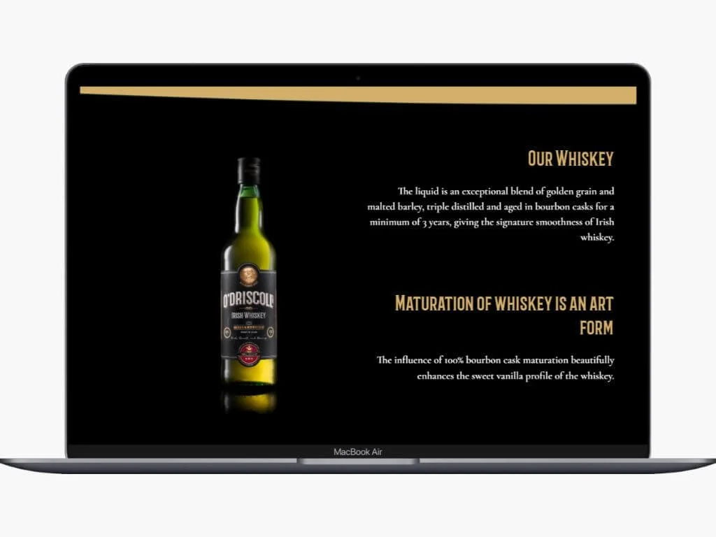 A computer screen displaying a black background with gold and white text, an image of a whiskey bottle, and headings about whiskey and its maturation process.