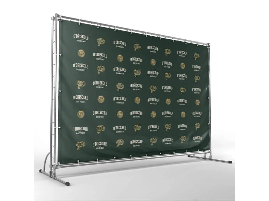 A green backdrop with gold logos and text that reads "O'BRISCOLL" and "Irish Whiskey," supported by a metal frame.