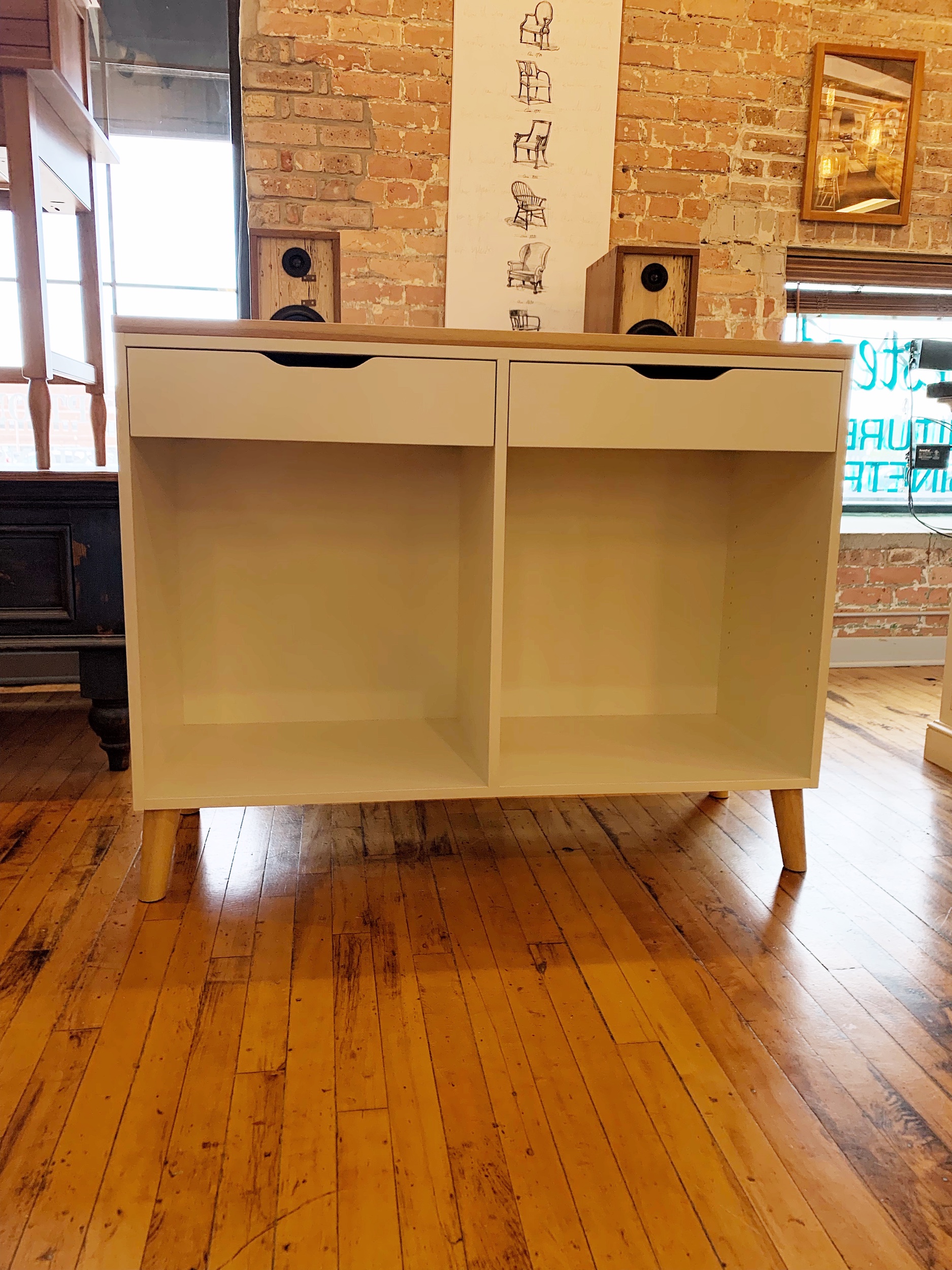 A painted modern changing table with hickory top and legs. 