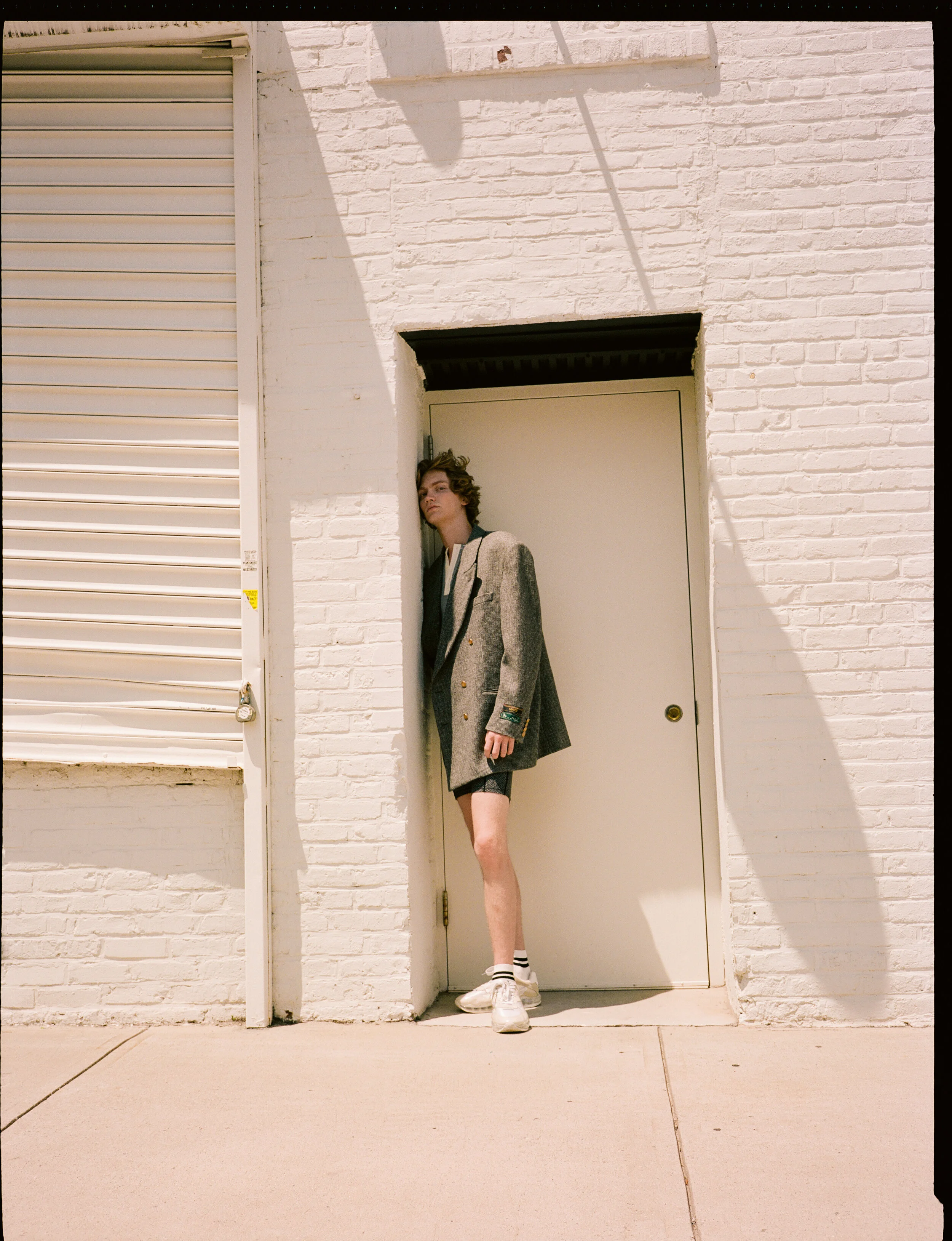 Coat GUCCI Top BALLY Shorts and Shoes ALEXANDER WANG
