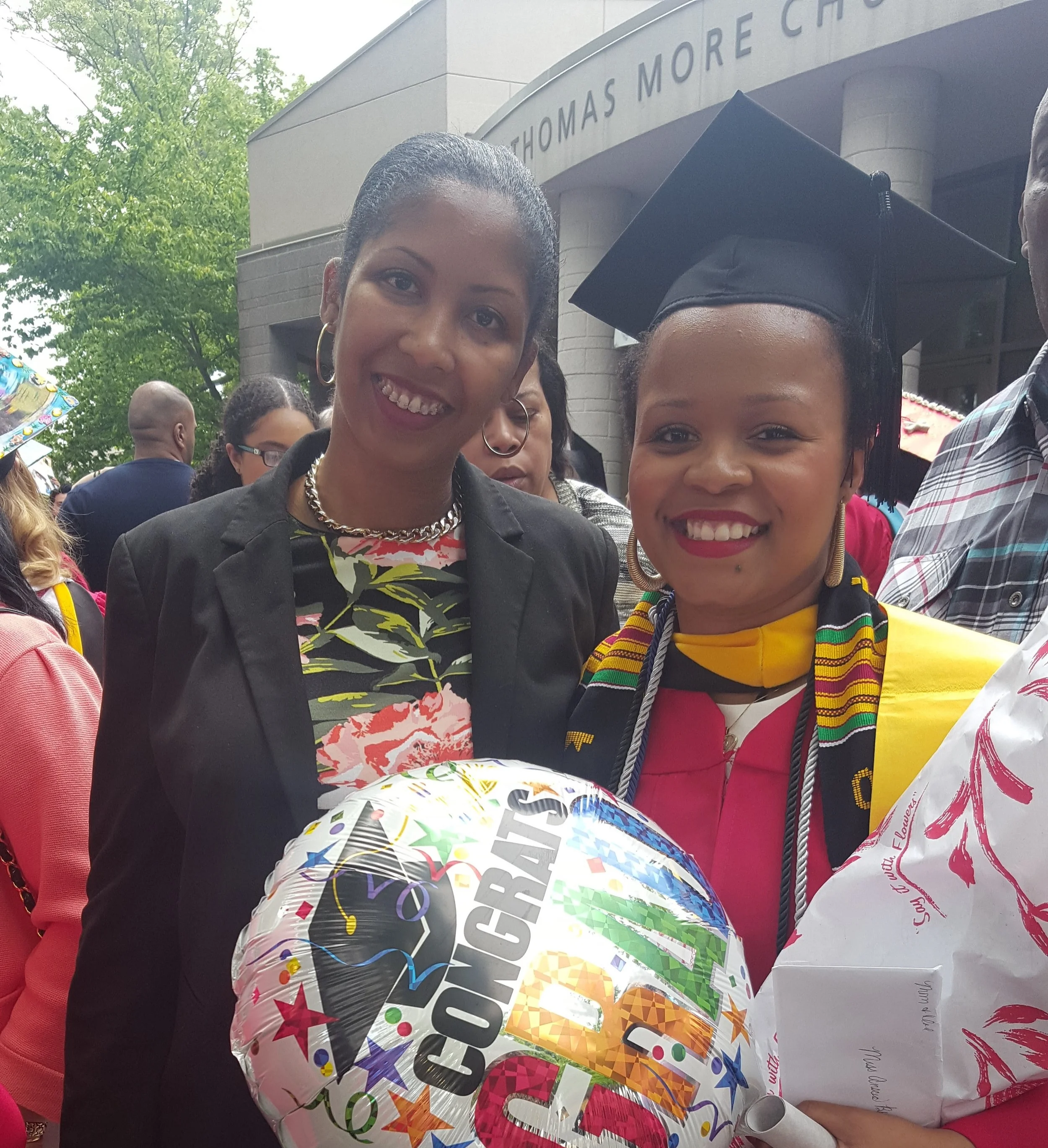 Anscia and her advisor, Ms. Baker, at her graduation from St. John's University.