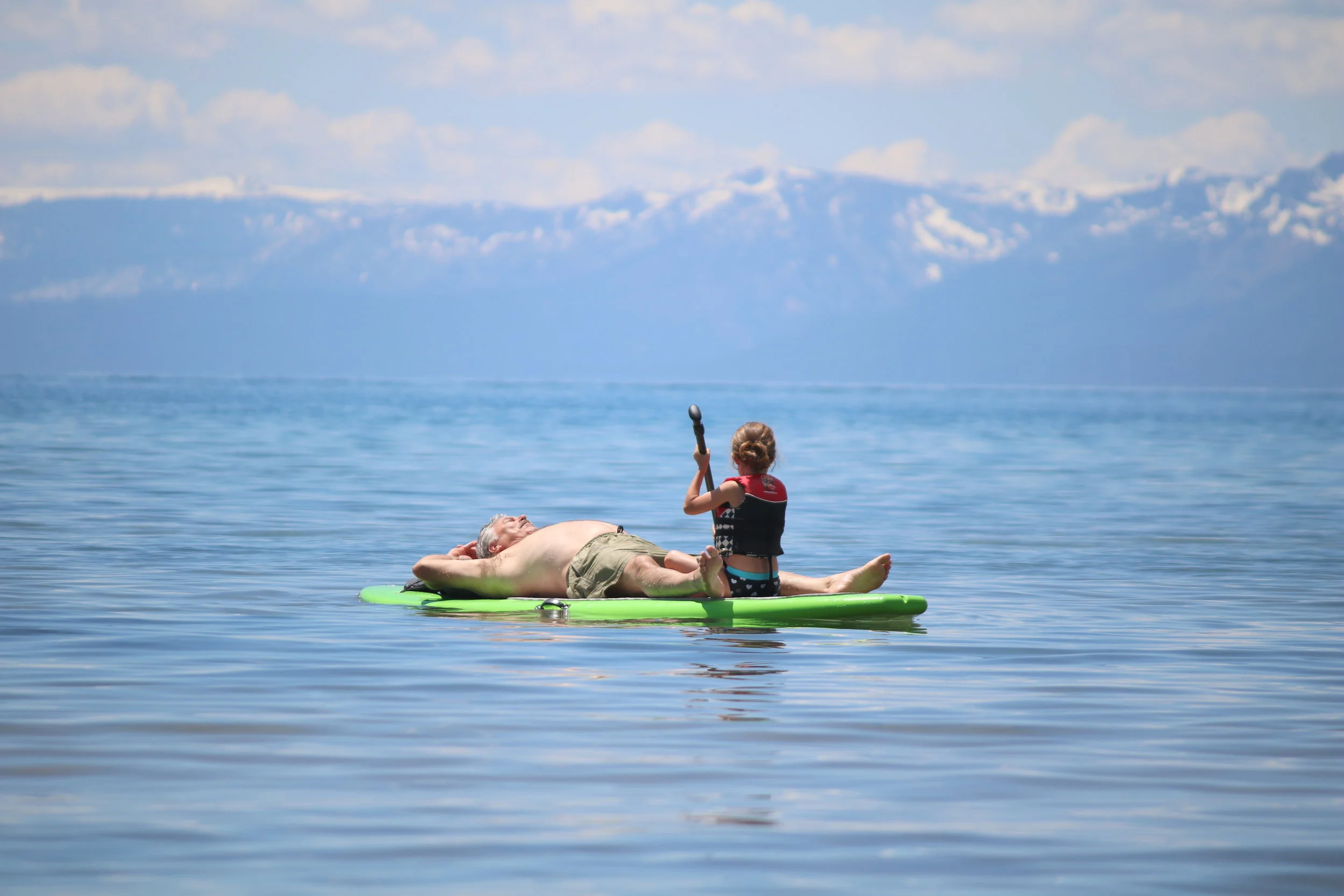 Couple Sharing Paddle Board