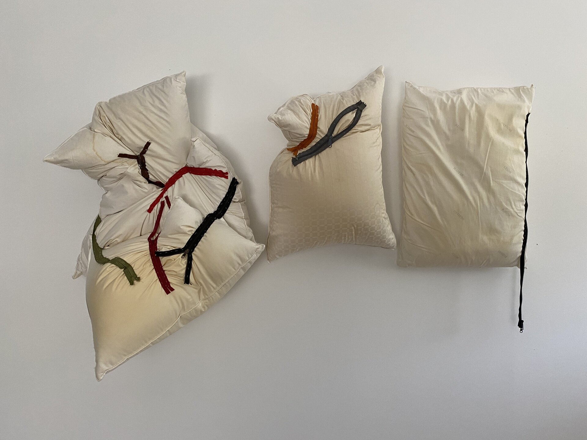   Carol Paik  “Configurations I” 31" x 60" x 10"; pillows, zippers, thread $1000. 