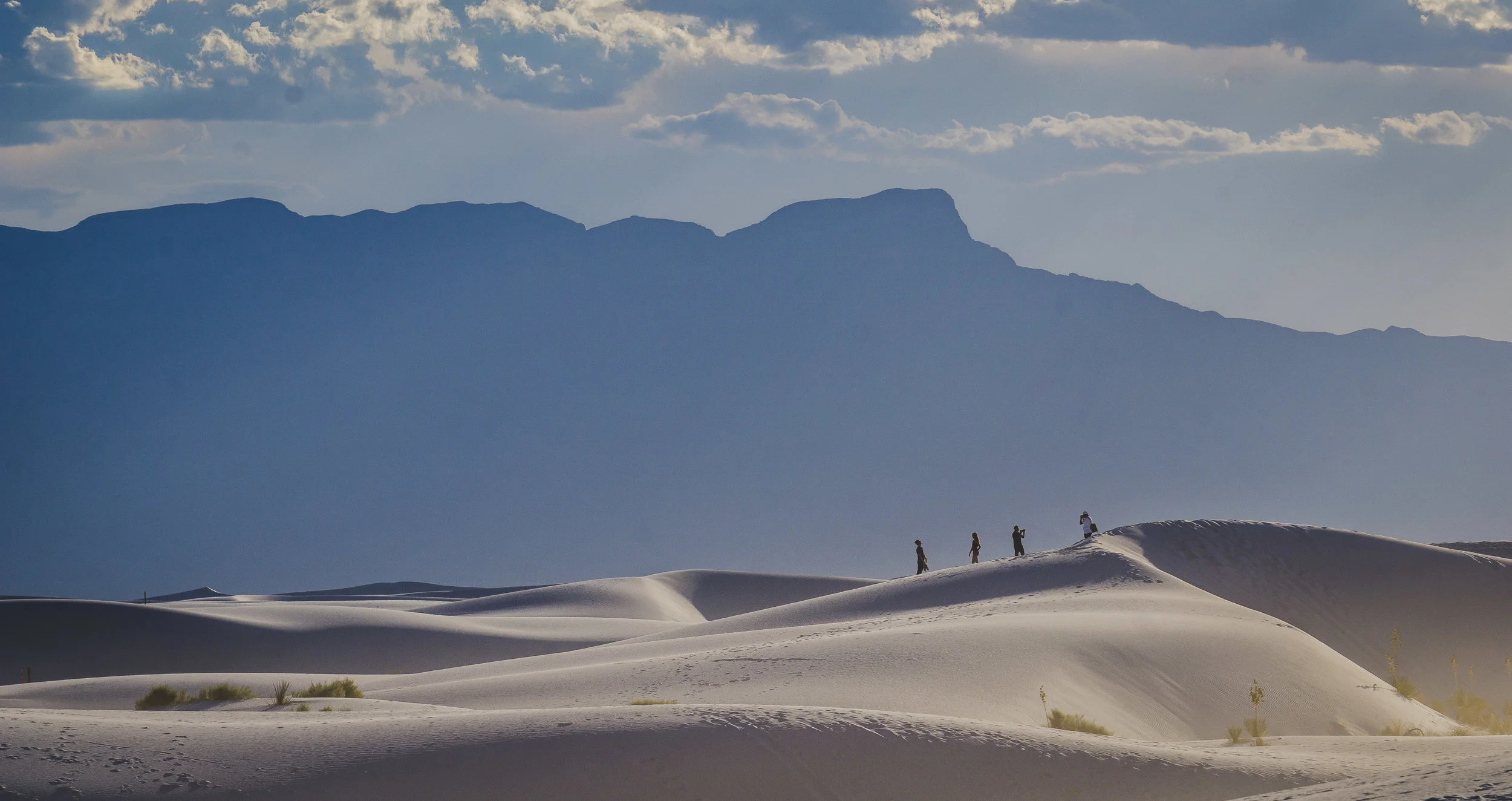 four hikers against mountain.jpg