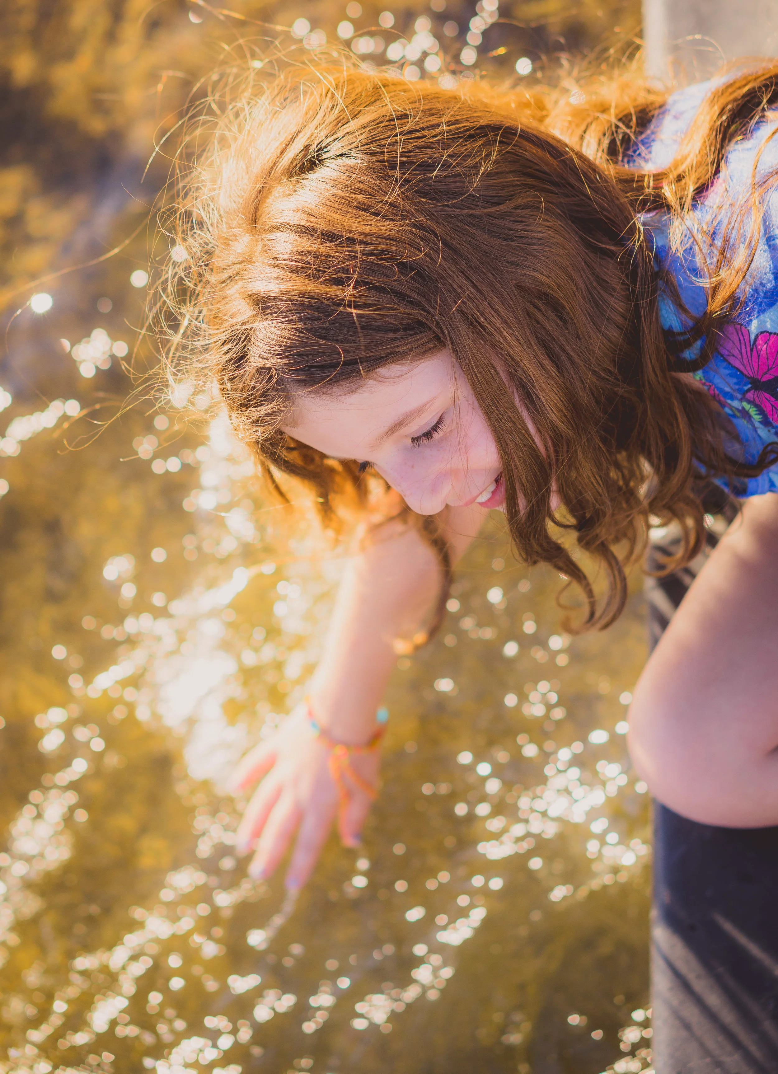 camila reaching for the water.jpg