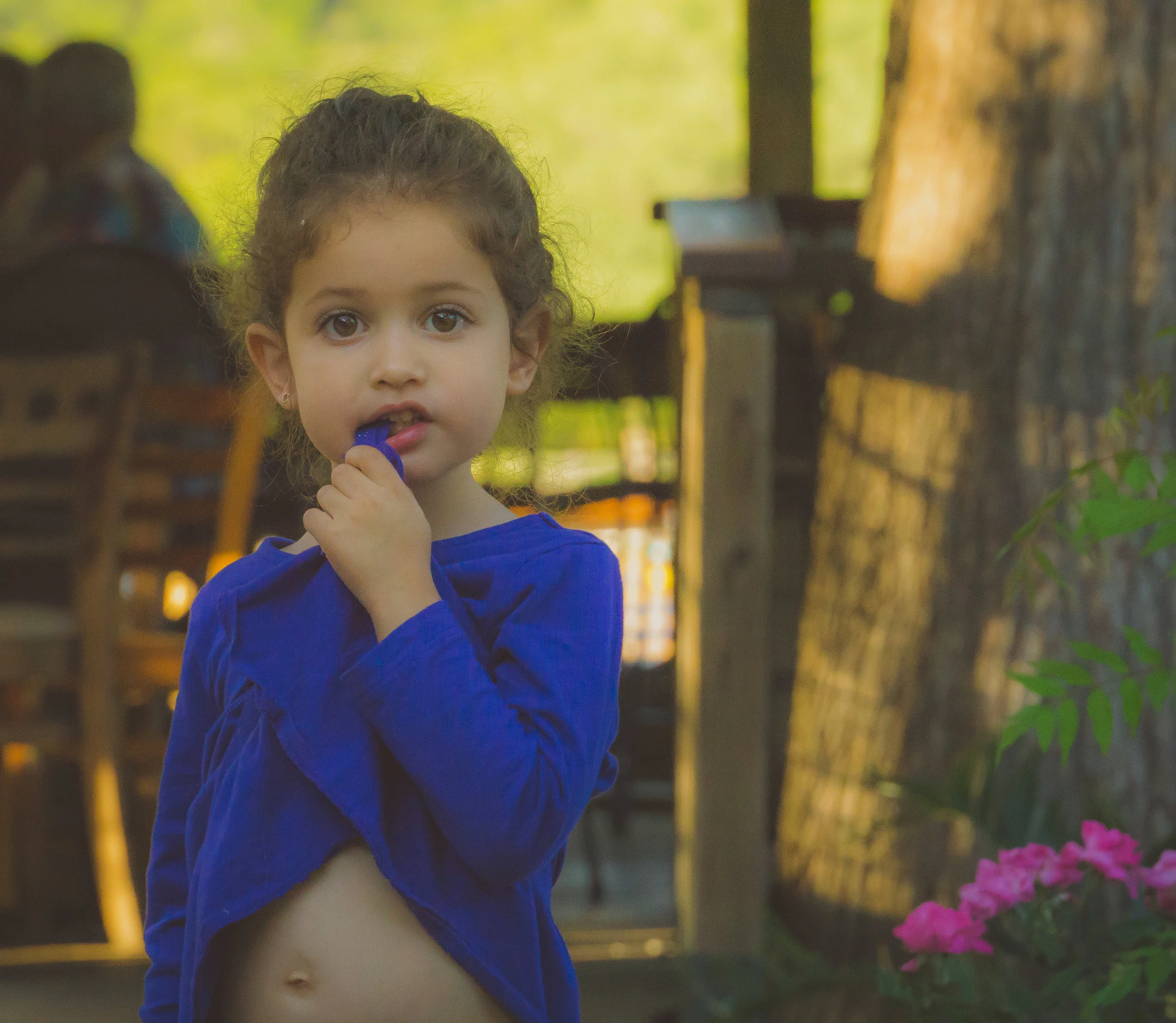 little girl eating shirt square.jpg