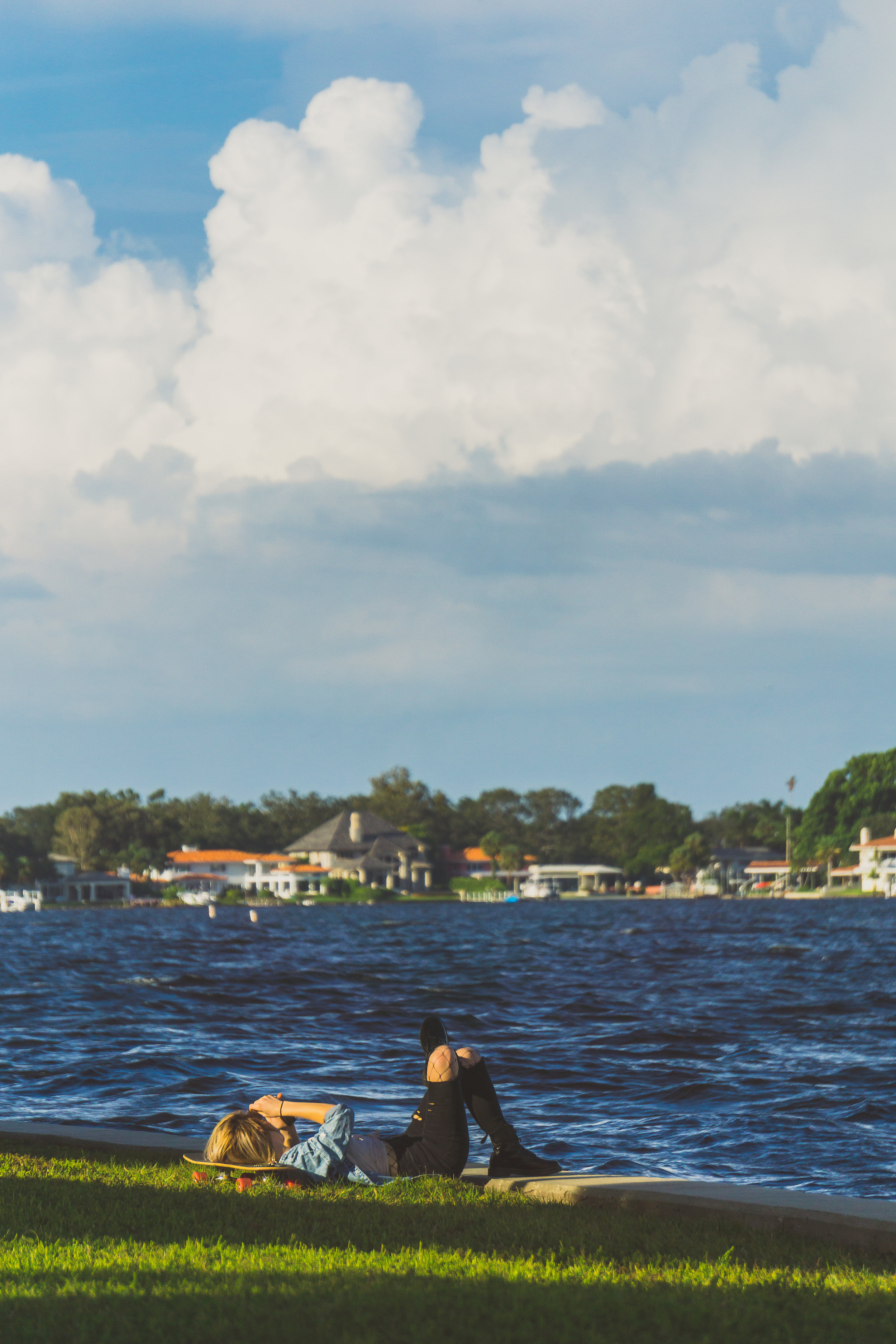 st. pete oct 7 skater girl laying down by bay.jpg