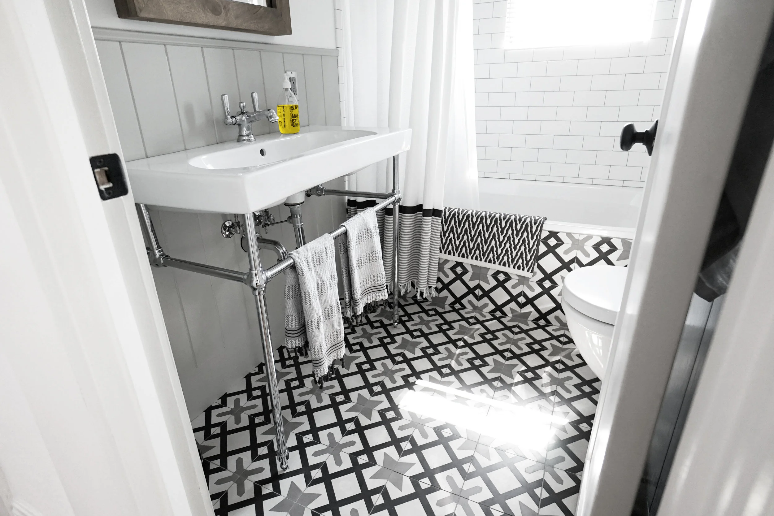 Bath - Tasteful, elegant, with double-wide sink, and European bespoke tiles and fixtures.