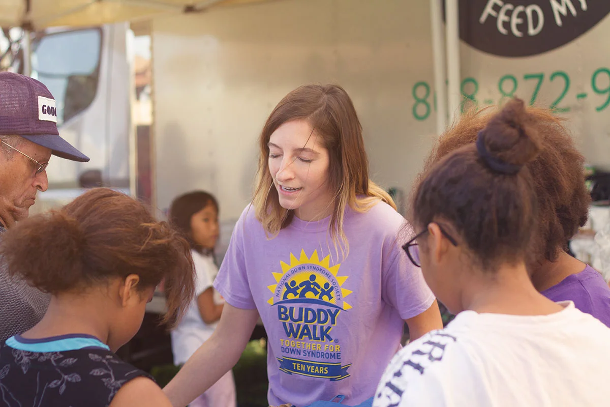 Volunteer serving families through Feed My Sheep