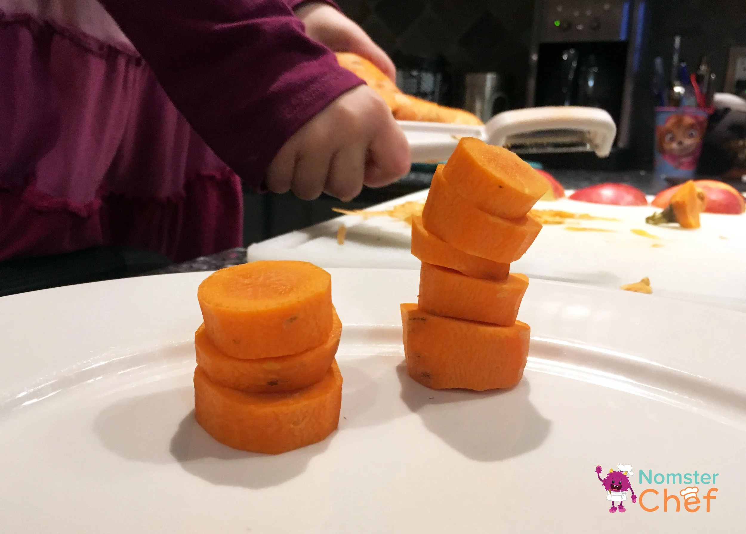 Chef Emma’s Carrot Stacks recipe in progress. This idea included making a visually appealing platter of fruits and vegetable. Not all of the ideas have to involve heat (i.e. cooking the ingredients). Here, Emma practices her plating and balance (as in art terms!) skills.