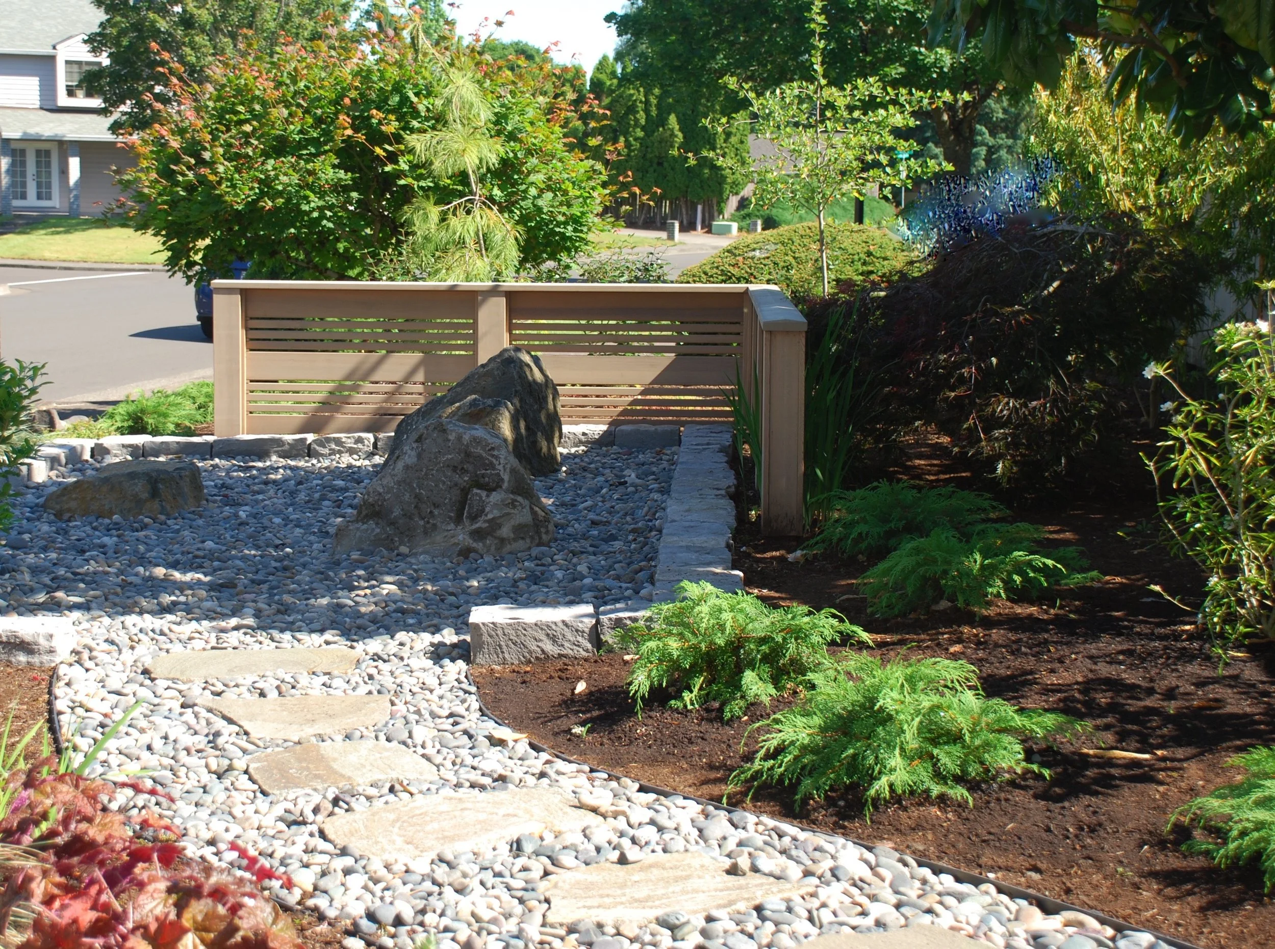 After I, Suburban house. Drought tolerant, no lawn. Carolyn was helping during installation when a neighbor drove by and rolled down her window. "What are you doing?" she asked, "Everyone else here has grass." 