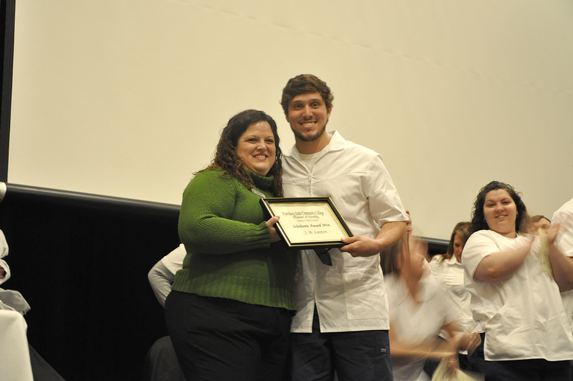 DSCC Nursing Instructor Christy Hamilton (left) presented the Scholastic Award to traditional nursing class graduate J.B. Laxton (right) of Munford, for achieving a 3.5 GPA in the nursing program.