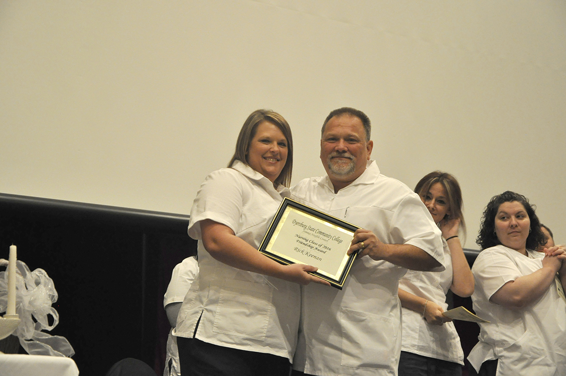 Nursing graduate Teresa Robbins (left) of Munford presented the Friendship Award to fellow classmate Richard Keenan (right) of Drummonds during DSCC’s Nursing Pinning Ceremony Dec. 9.