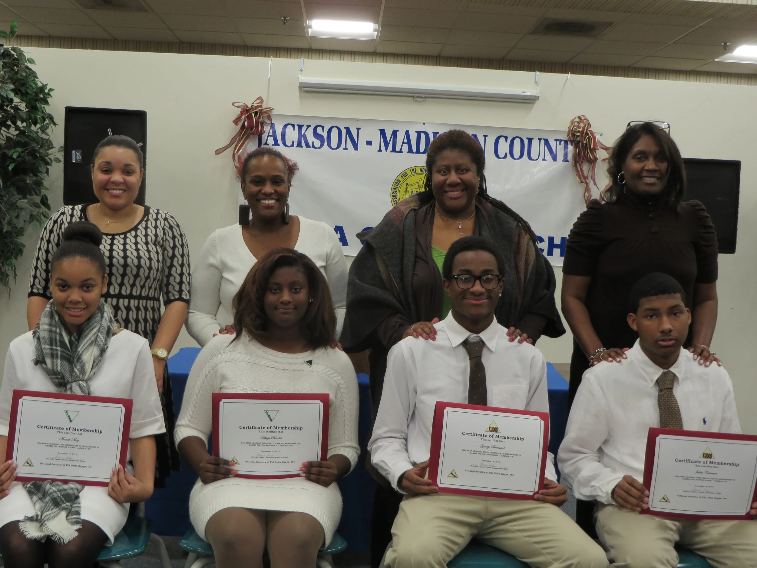 Left to right standing: Marsha May, Takisha Spencer, Velma Berniard, and Vicki Coleman Left to right seated: Annah May, Takiya Rhodes, George Berniard, and Jabin Coleman