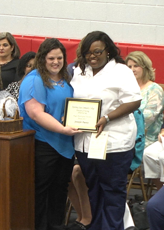 DSCC nursing instructor Christy Hamilton (left) presented the Peggy Pendergrast Faculty Award to nursing graduate Jennifer Puente (right) of Jackson.