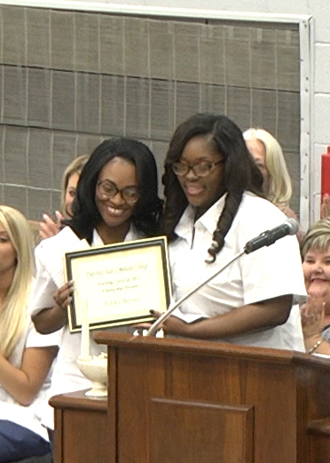 Nursing graduate Raven Warren (right) of Dyersburg presented the Friendship Award to fellow classmate Ashley Barnes (left) of Henning during DSCC’s nursing pinning ceremony May 6.