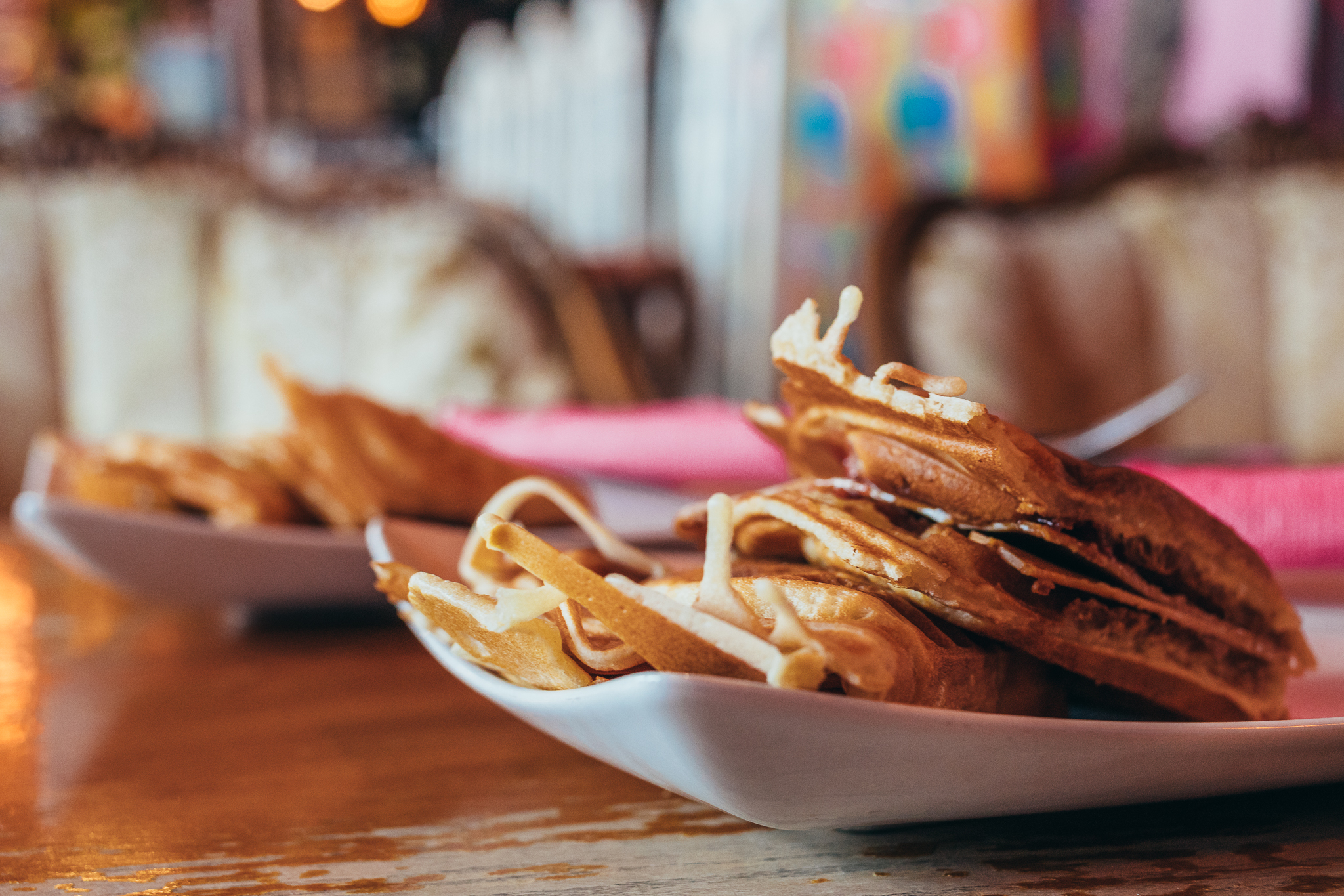 Traditional Norwegian waffles with brown cheese and raspberry jam. The location that serves it is just as unique: Bar Barista.