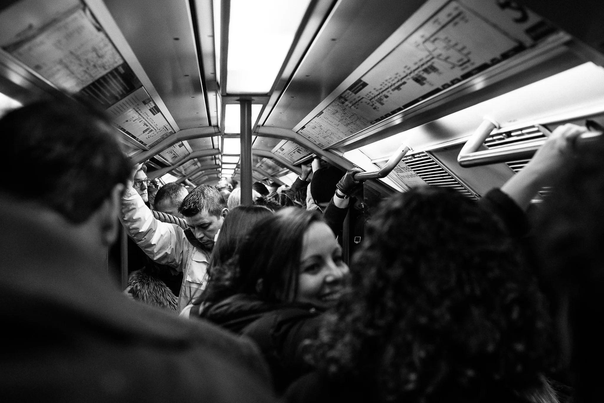 Here’s a solid example of the Rule of Thirds, with the subject (man on left-hand side) occupying the first-third of the photograph. This was on the tube during rush hour in London.