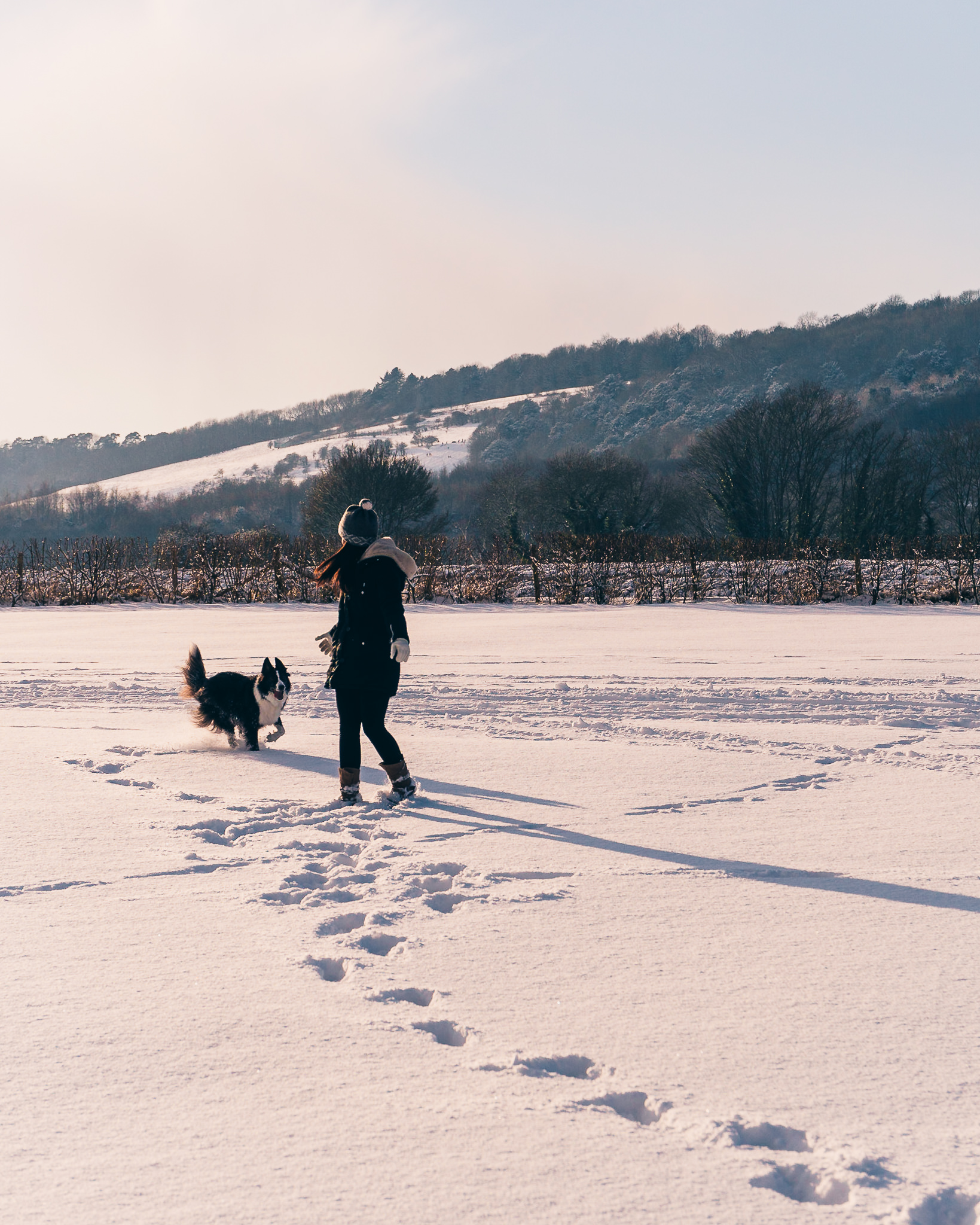 Here’s another example of the Rule of Thirds, in the town of Sevenoaks. Placing the subjects all the way to the left works in this case because of the strong leading lines that begin on the right-hand side (footprints, trees, and mountains). Read the following tip for more on leading lines!