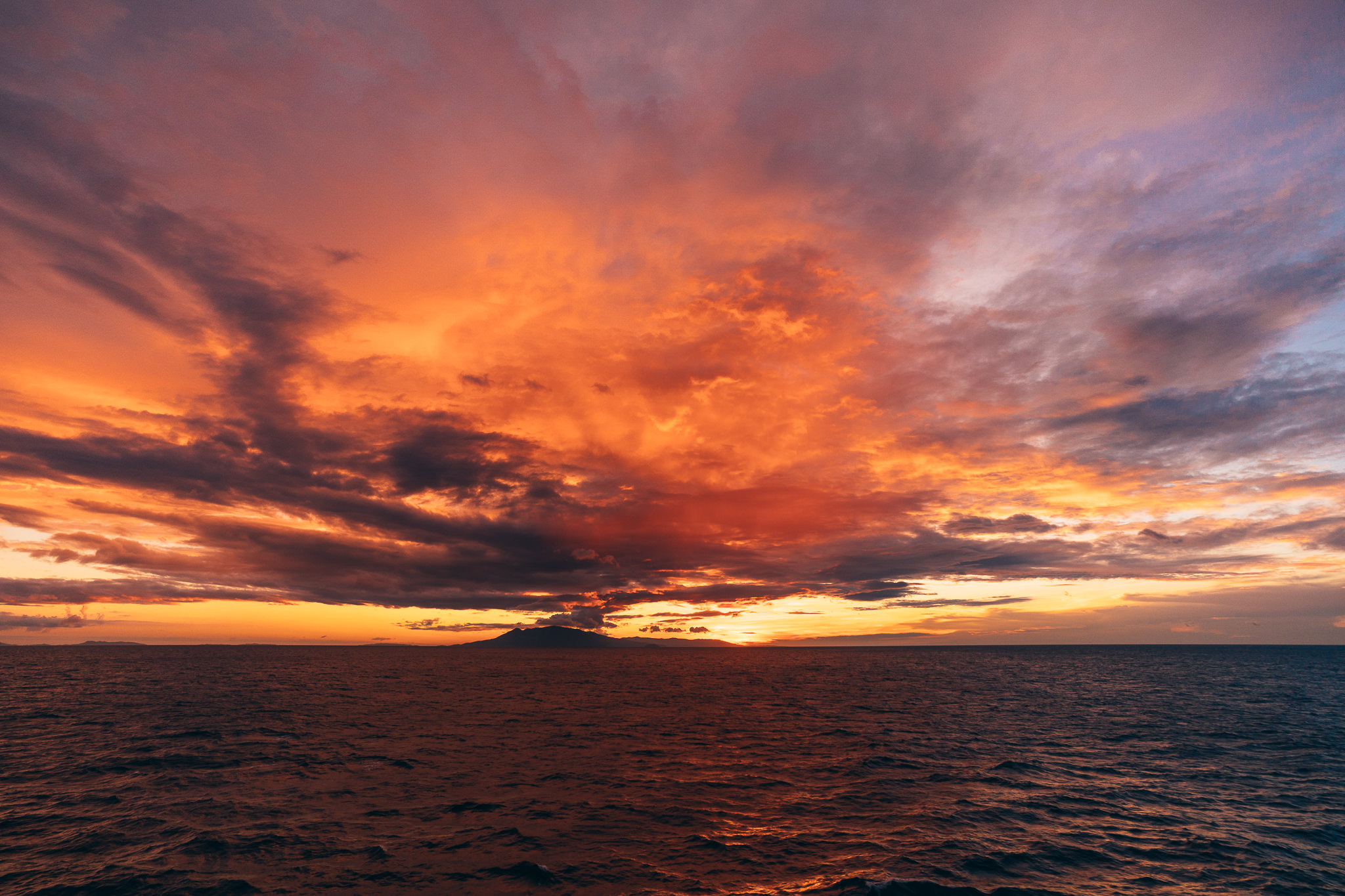 I was on a moving boat here and wanted to achieve maximum sharpness on a subject that, well, wasn't moving (the mountain and sunset). Thus, I focused manually.