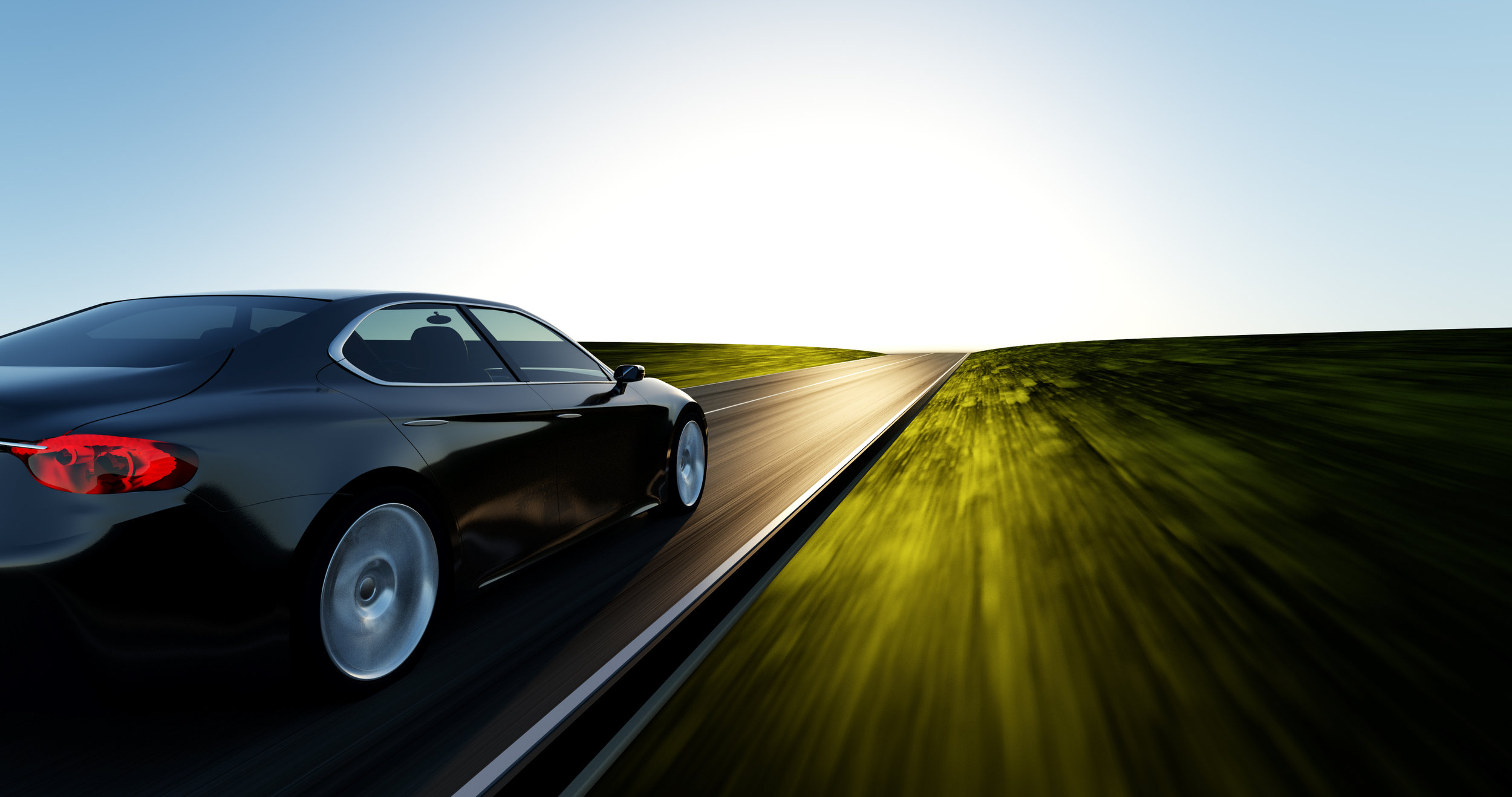 car-driving-on-a-sunset-road-916540838_4096x2160.jpeg