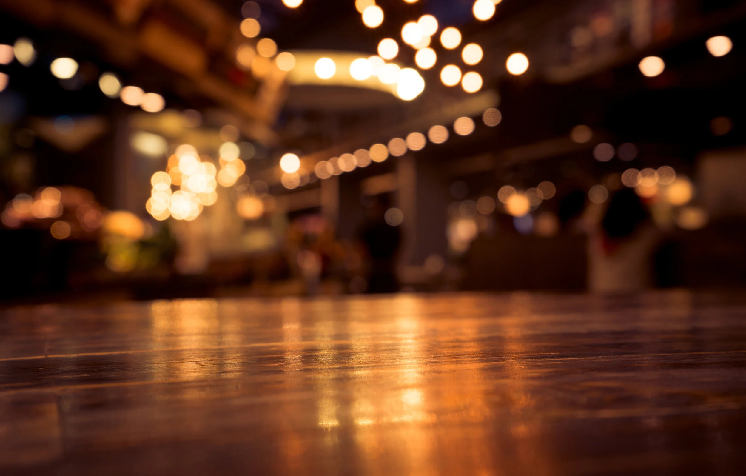 Wood-table-on-blur-cafe-(bar)-with-light-background-802636540_6000x3827.jpeg