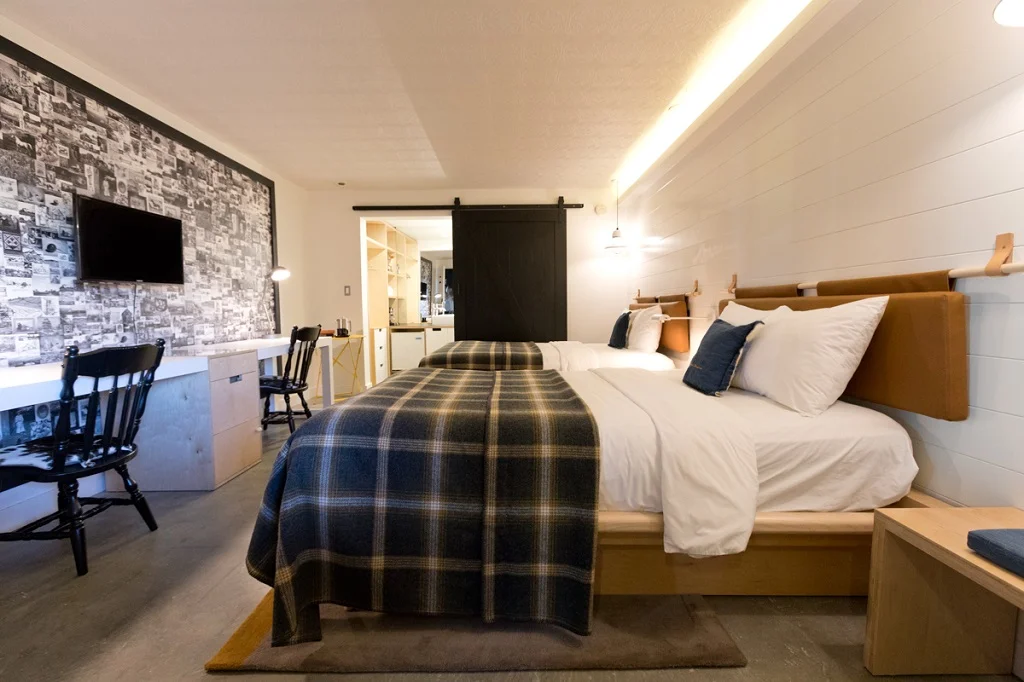 The Farmer’s Daughter Hotel , 115 S Fairfax Ave, Los Angeles, CA 90036, a 66-room boutique hotel in Los Angeles’ Beverly Grove district. Barn wallpaper design by Welcome to the Brightside.