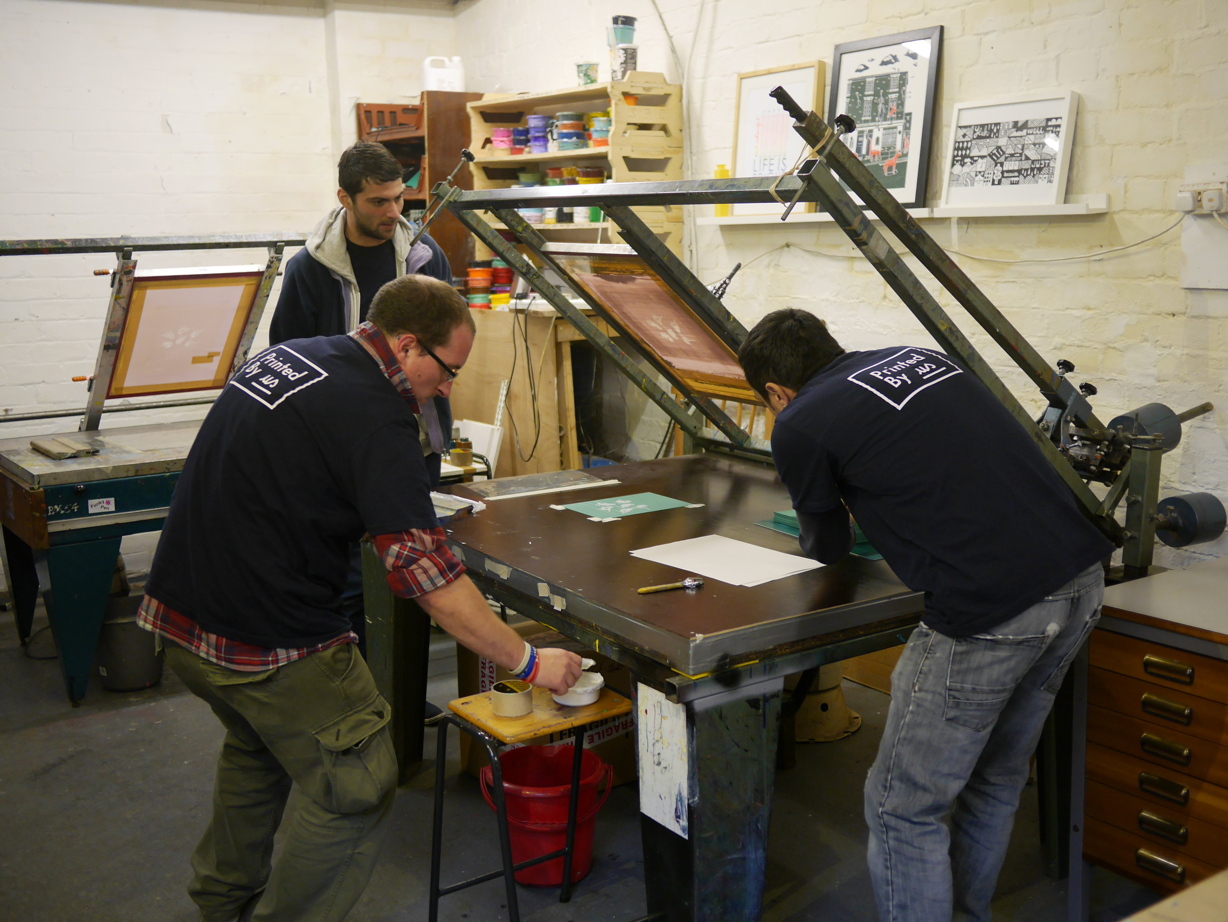 Teamwork makes the dream work as they say. James, Hugo and Kameron working together to print Sleepover.