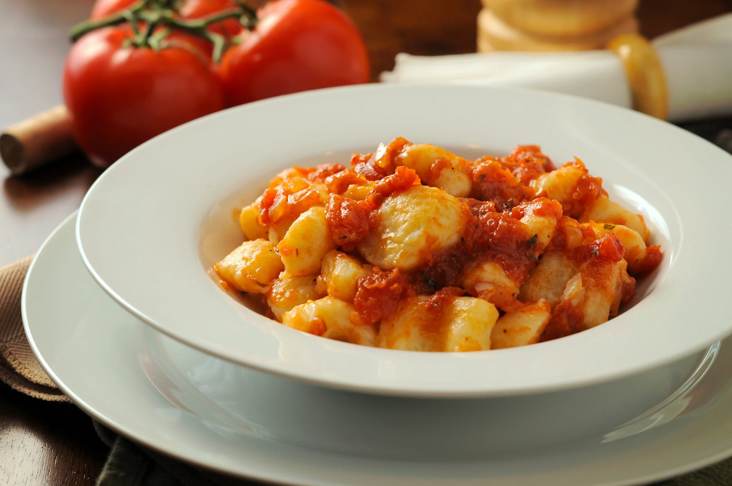 Traditional potato gnocchi finished in a light red sauce. Photo credit: Jason Poole @ http://analogjeans.com/