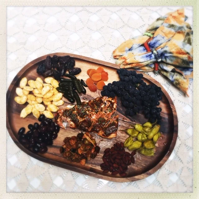 The salmon was served as the feature on a snack board for friends to share.