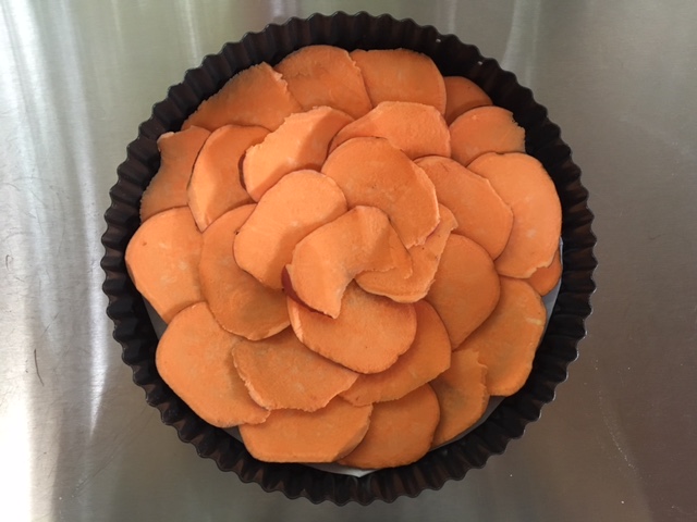 Build a crust out of a layer of sweet potato slices.