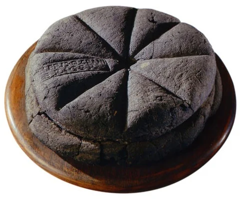 lordhayati :
drtanner :
dancingspirals :
ironychan :
hungrylikethewolfie :
dduane :
wine-loving-vagabond :
A loaf of bread made in the first century AD, which was discovered at Pompeii, preserved for centuries in the volcanic ashes of Mount Vesuvius. The markings visible on the top are made from a Roman bread stamp, which bakeries were required to use in order to mark the source of the loaves, and to prevent fraud. (via Ridiculously Interesting )
(sigh) I’ve seen these before, but this one’s particularly beautiful.
I feel like I’m supposed to be marveling over the fact that this is a loaf of bread that’s been preserved for thousands of years, and don’t get me wrong, that’s hella cool. But honestly, I’m mostly struck by the unexpected news that “bread fraud” was apparently once a serious concern.
Bread Fraud was a huge thing, Bread was provided to the Roman people by the government - bakers were given grain to make the free bread, but some of them stole the government grain to use in other baked goods and would add various substitutes, like sawdust or even worse things, to the bread instead. So if people complained that their free bread was not proper bread, the stamp told them exactly whose bakery they ought to burn down.
Bread stamps continued to be used at least until the Medieval period in Europe. Any commercially sold bread had to be stamped with an official seal to identify the baker to show that it complied with all rules and regulations about size, price, and quality. This way, rotten or undersized loaves could be traced back to the baker. Bakers could be pilloried, sent down the streets in a hurdle cart with the offending loaf tied around their neck, fined, or forbidden to engage in baking commercially ever again in that city. There are records of a baker in London being sent on a hurdle cart because he used an iron rod to increase the weight of his loaves, and another who wrapped rotten dough with fresh who was pilloried. Any baker hurdled three times had to move to a new city if they wanted to continue baking.
If you have made bread, you are probably familiar with a molding board. It’s a flat board used to shape the bread. Clever fraudsters came up with a molding board that had a little hole drilled into it that wasn’t easily noticed. A customer would buy his dough by weight, and then the baker would force some of that dough through the hole, so they could sell and underweight loaf and use the stolen dough to bake new loafs to sell. Molding boards ended up being banned in London after nine different bakers were caught doing this. There were also instances of grain sellers withholding grain to create an artificial scarcity drive up the price of that, and things like bread.
Bread, being one of the main things that literally everyone ate in many parts of the world, ended up with a plethora of rules and regulations. Bakers were probably no more likely to commit fraud than anyone else, but there were so many of them, that we ended up with lots and lots of rules and records of people being shifty.
Check out Fabulous Feasts: Medieval Cookery and Ceremony by Madeleine Pelner Cosman for a whole chapter on food laws as they existed in about 1400. Plus the color plates are fantastic .
Holy shit.
Bread is serious fucking business.
Man the bread fandom don’t put up with shit at all.