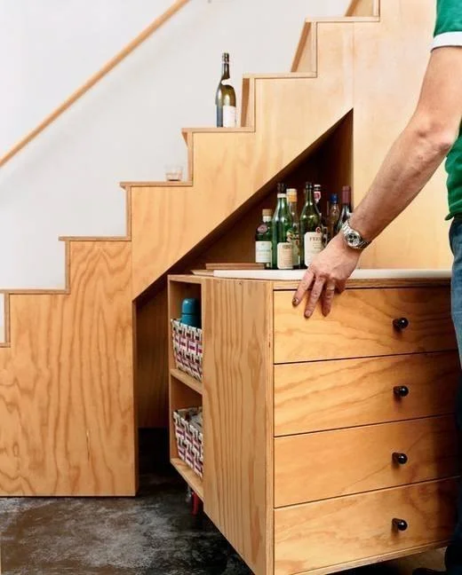 TinyHouseCottages under stairs storage.jpg