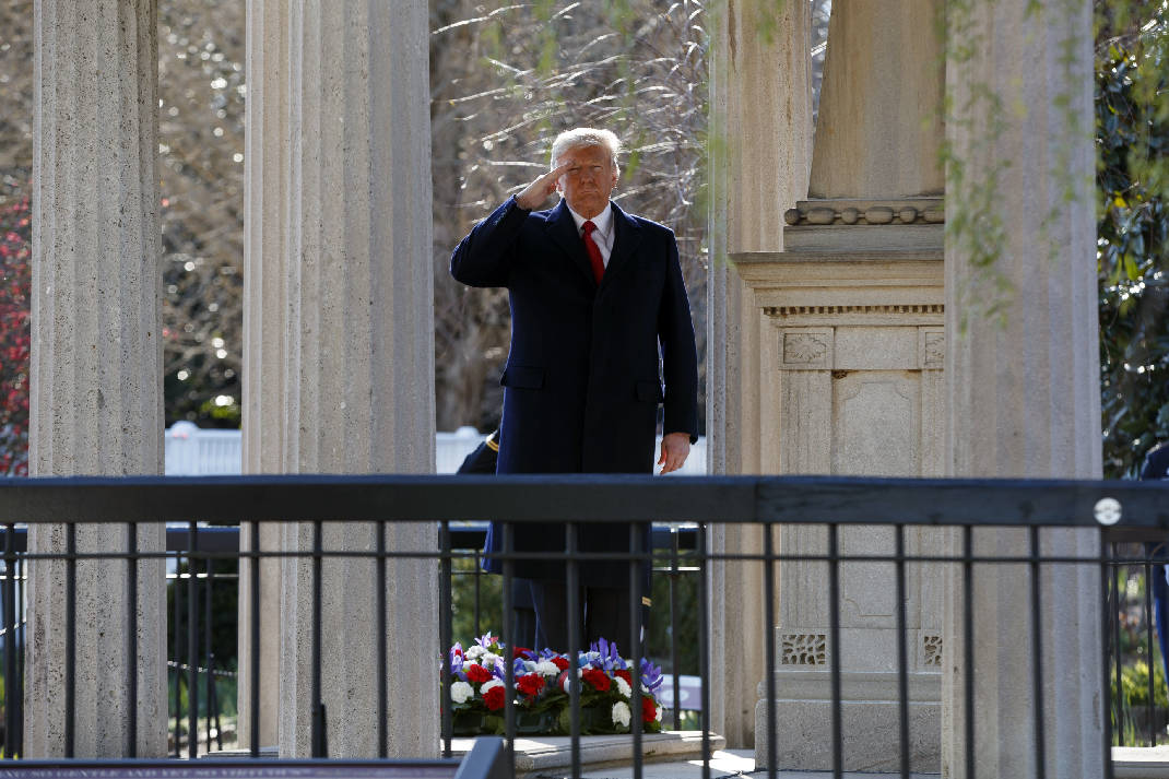 President Trump salutes after placing a wreath at Jackson's tomb. 