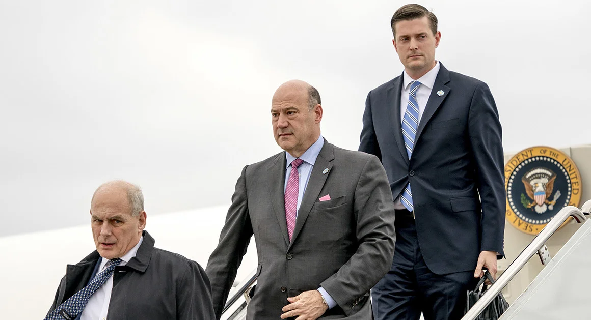 Gary Cohn and Rob Porter walking behind Chief of Staff, John Kelly.