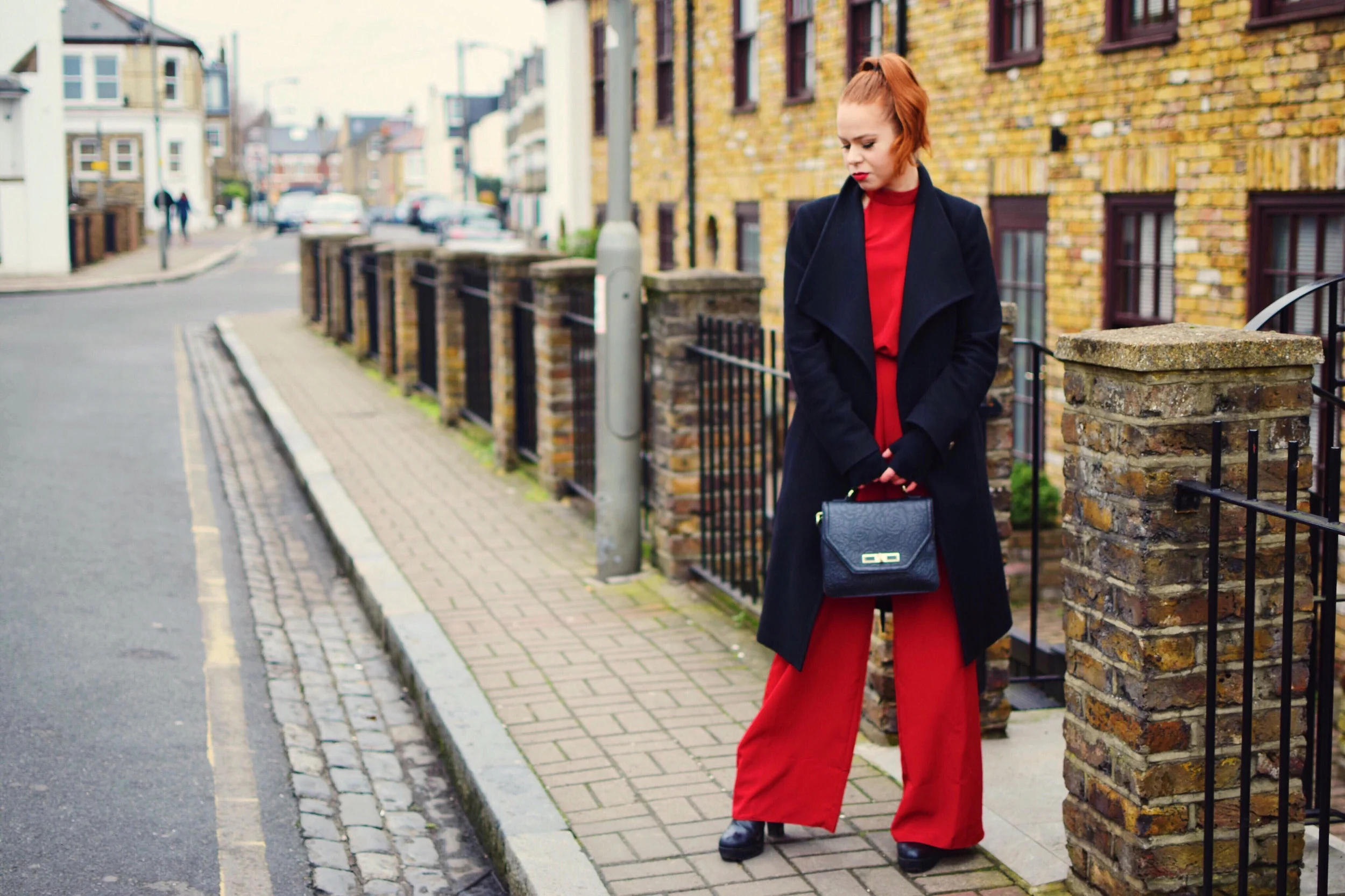 Photos by Glen Livingstone. I'm obsessed with this bold, wide- legged jumpsuit from Lipsy . I'm also wearing: Miss KG Boots, Coast handbag, marino fingerless gloves from NZ and Ted Baker coat (all linked below).