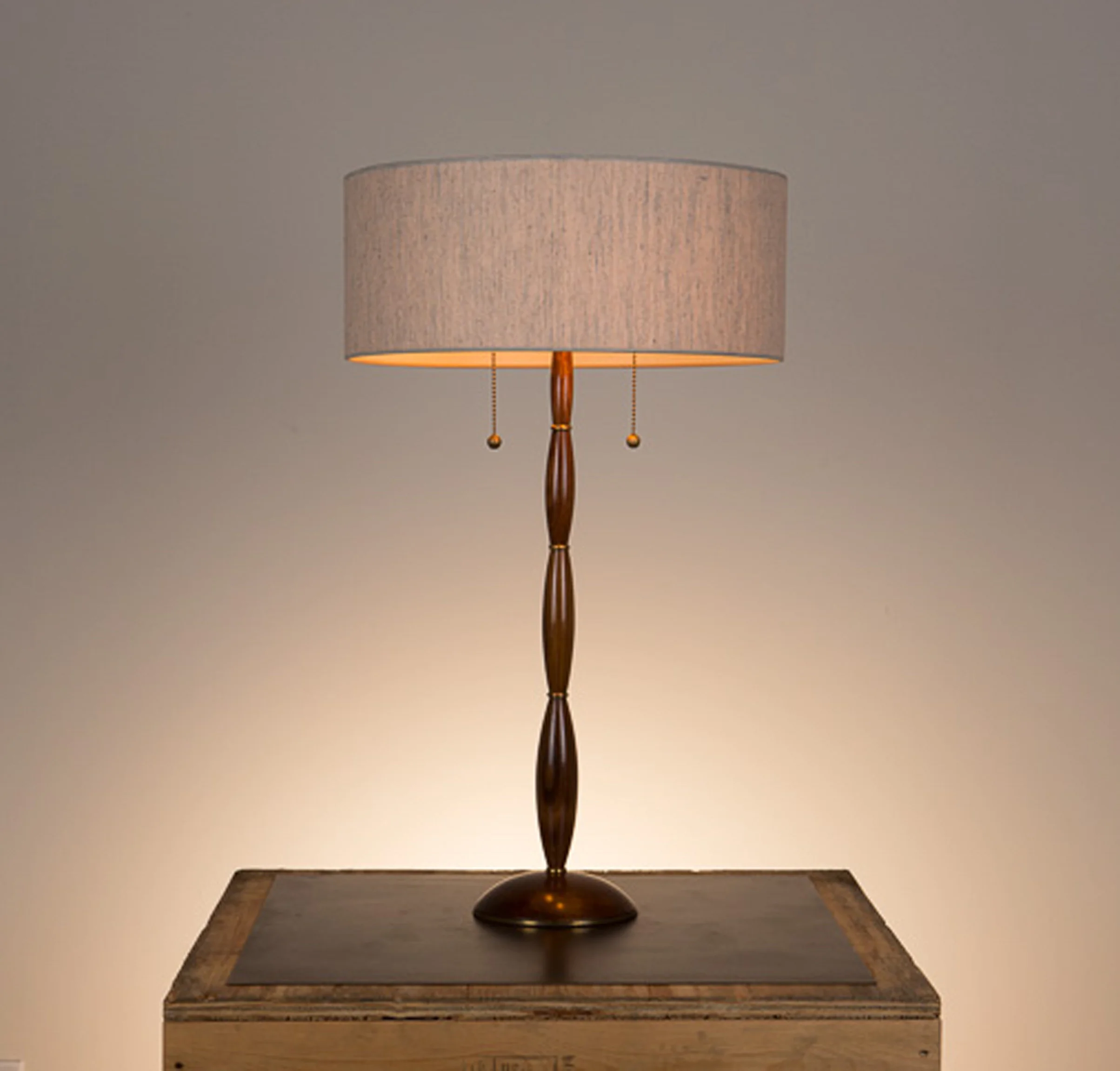 Alexis Table Lamp #1 Walnut in a medium brown finish, unlacquered hand polished brass fittings. Semi-closed top desk lamp shade in 817 beige linen.