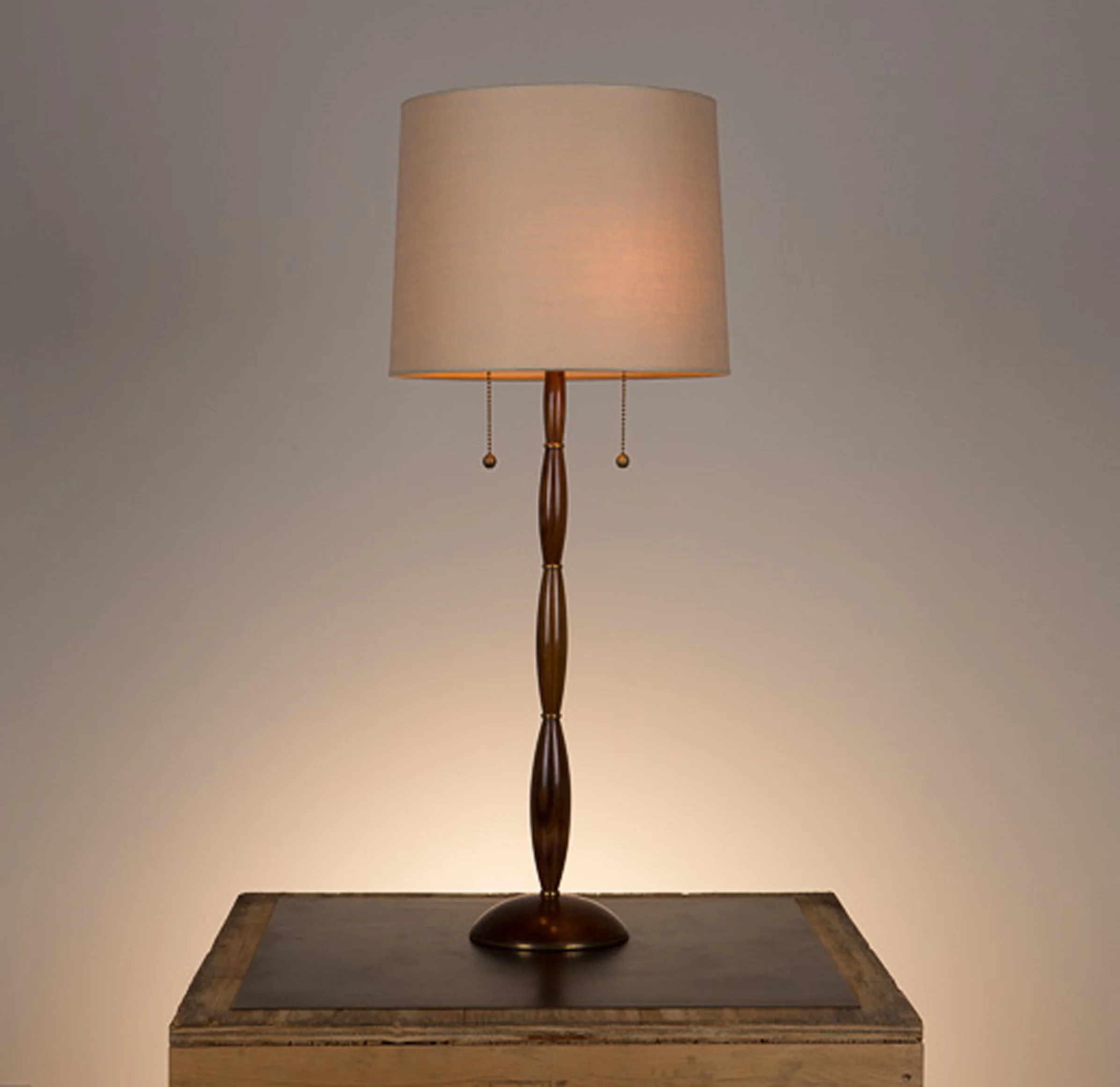 Alexis Table Lamp #2 Walnut in a medium brown finish, unlacquered hand polished brass fittings. 738 beige linen shade.