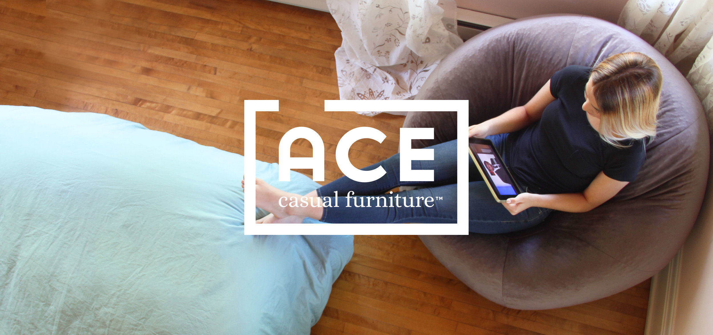 *A woman reclining on a beanbag using a tablet with ACE logo