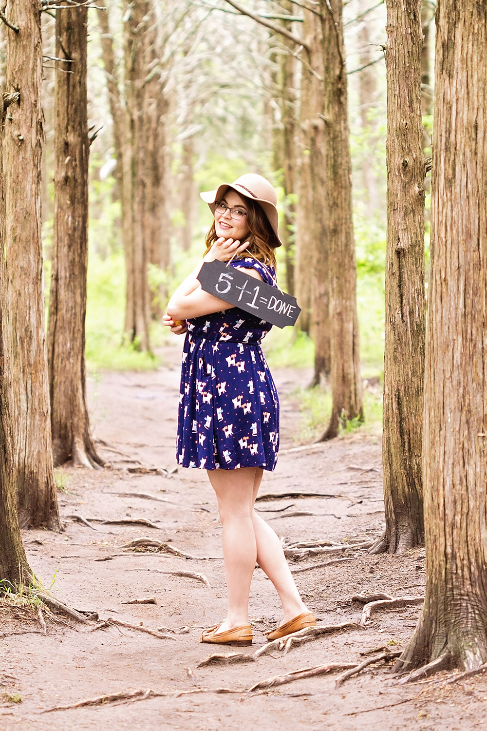 girl with sign in woods.jpg