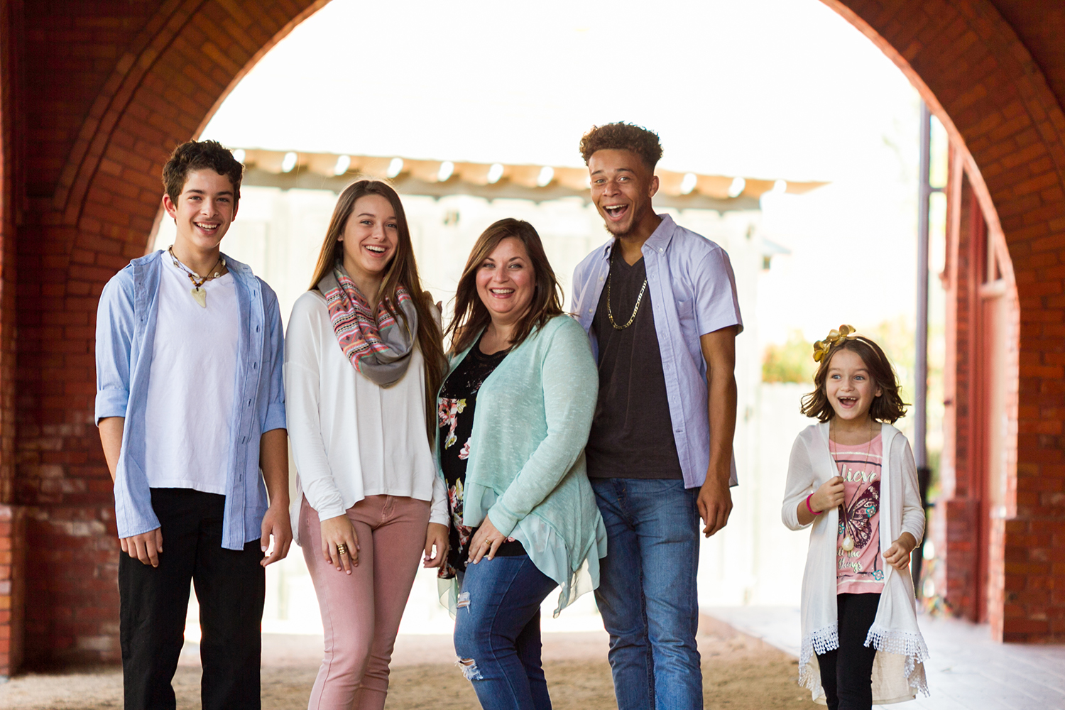 Family of 5 under brick arch.jpg