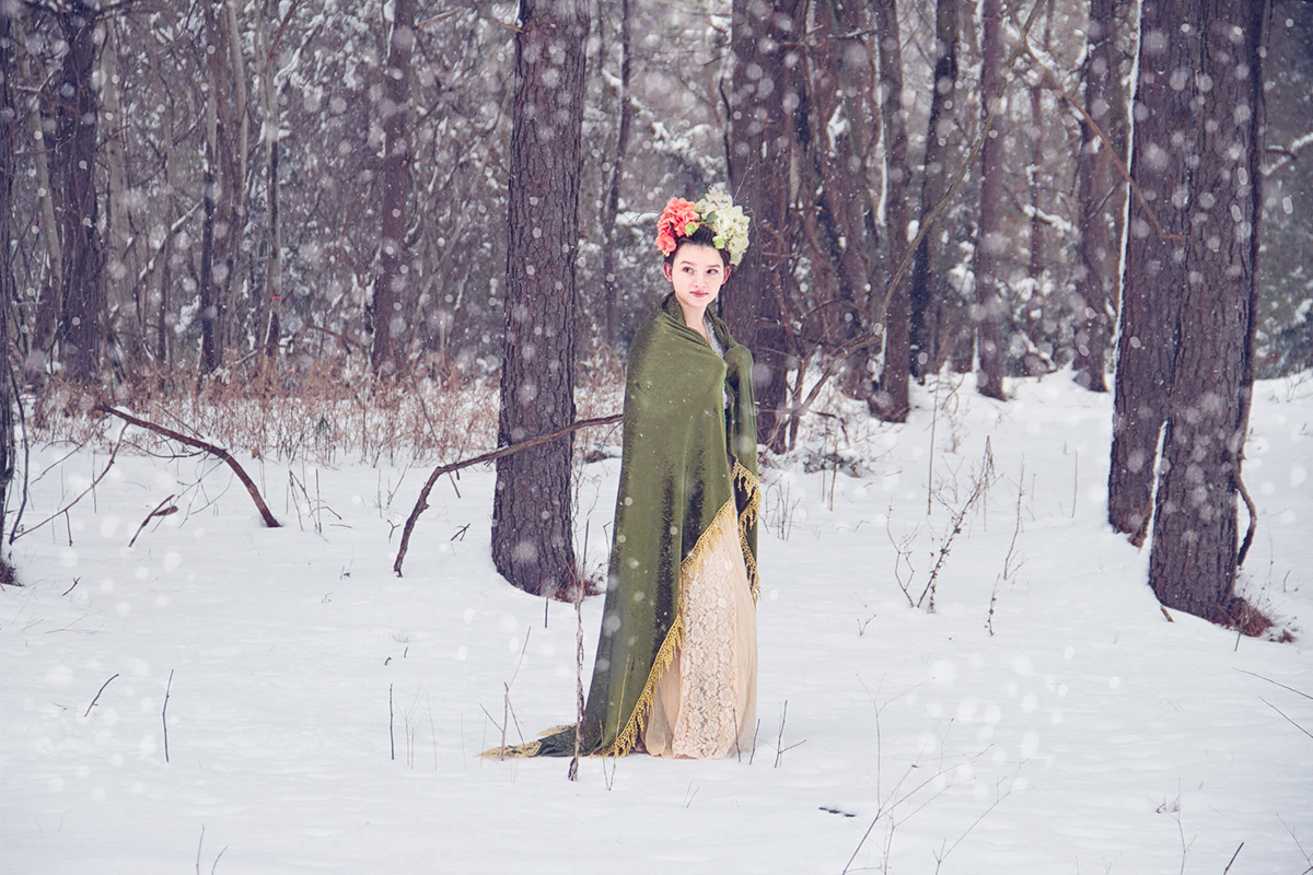 girl with floral hair in snowy forest.jpg