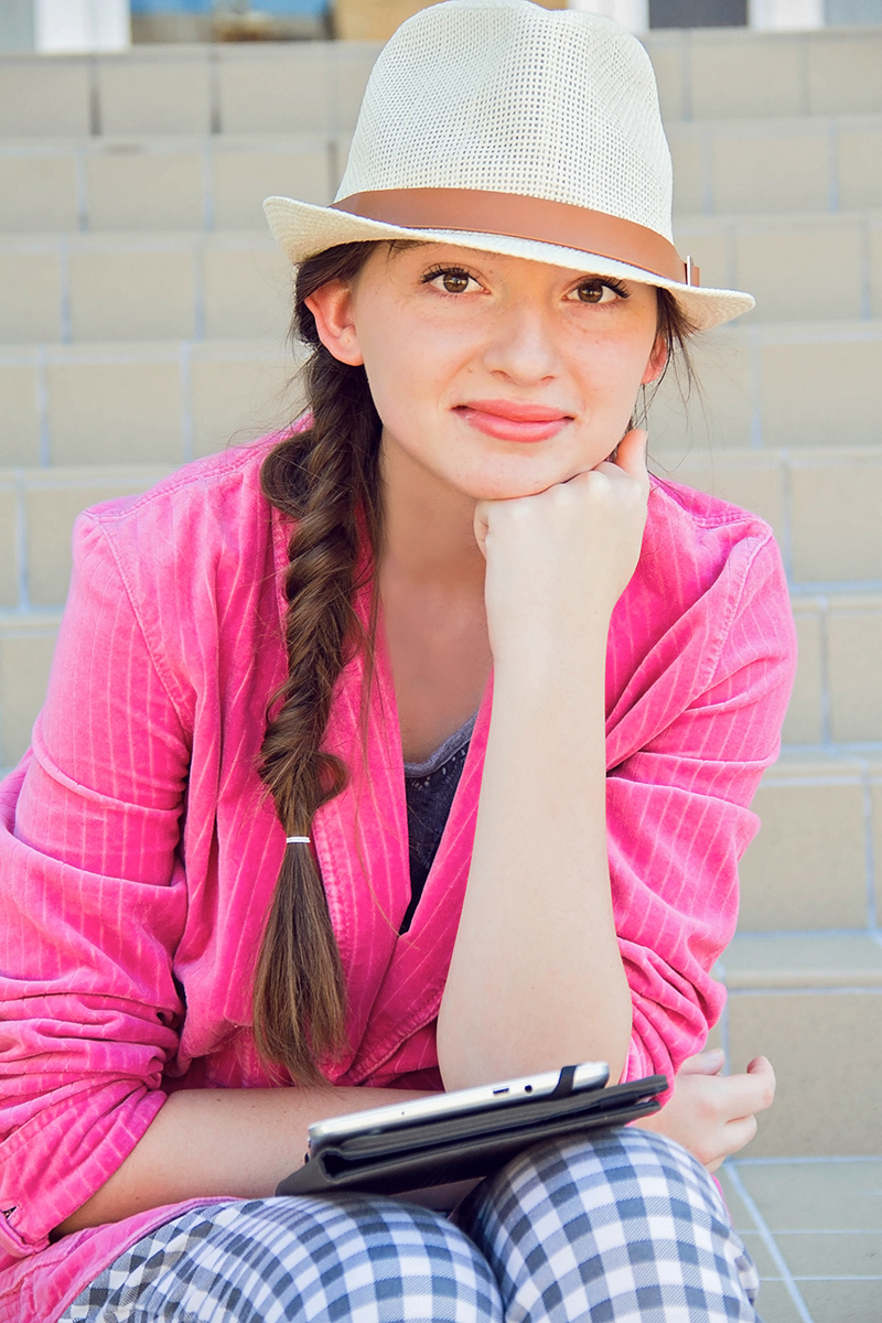 Pretty girl in pink on steps.jpg