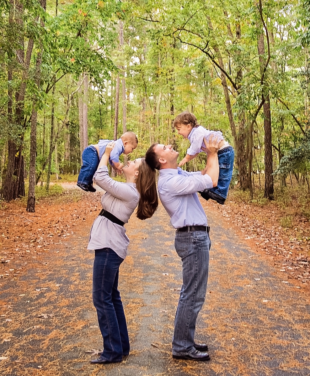 parents holding boys up in the air.jpg