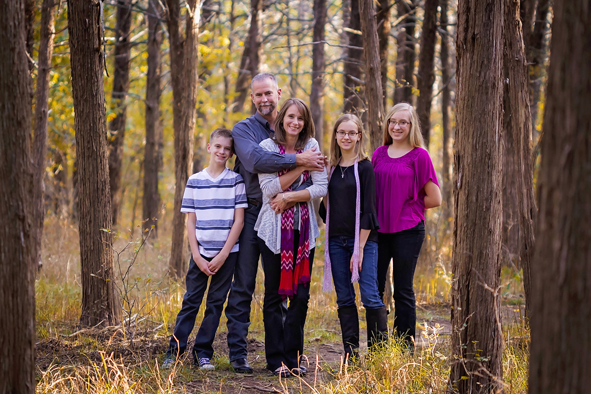 Happy family of 5 in the woods.jpg
