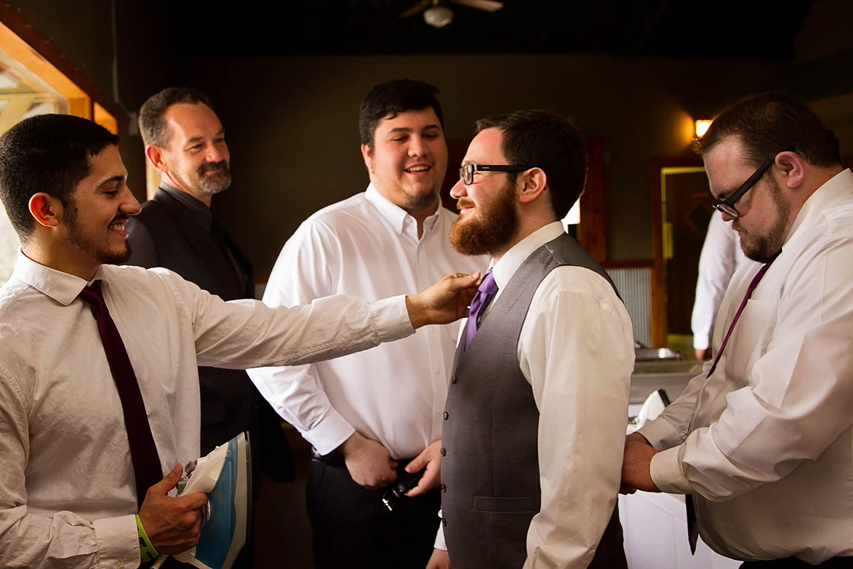 The groom getting ready with groomsmen.jpg